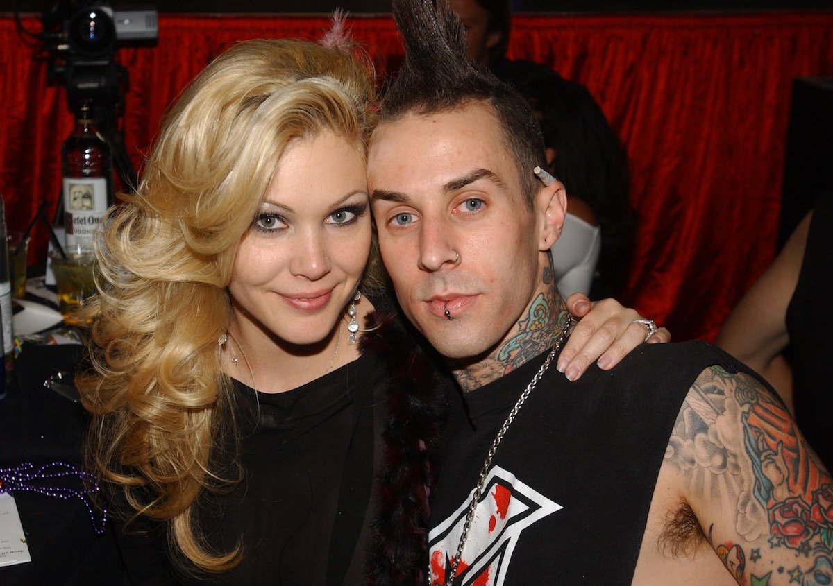 Shanna Moakler and Travis Barker pose together at an event.