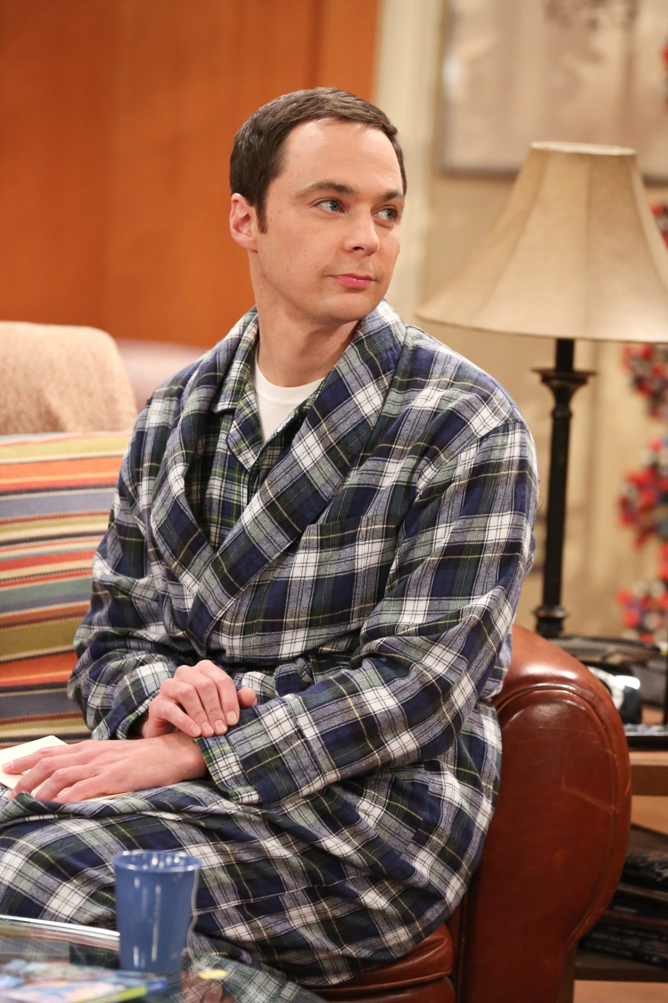 Jim Parsons as Sheldon Cooper sits on the couch in his apartment during 'The Big Bang Theory'