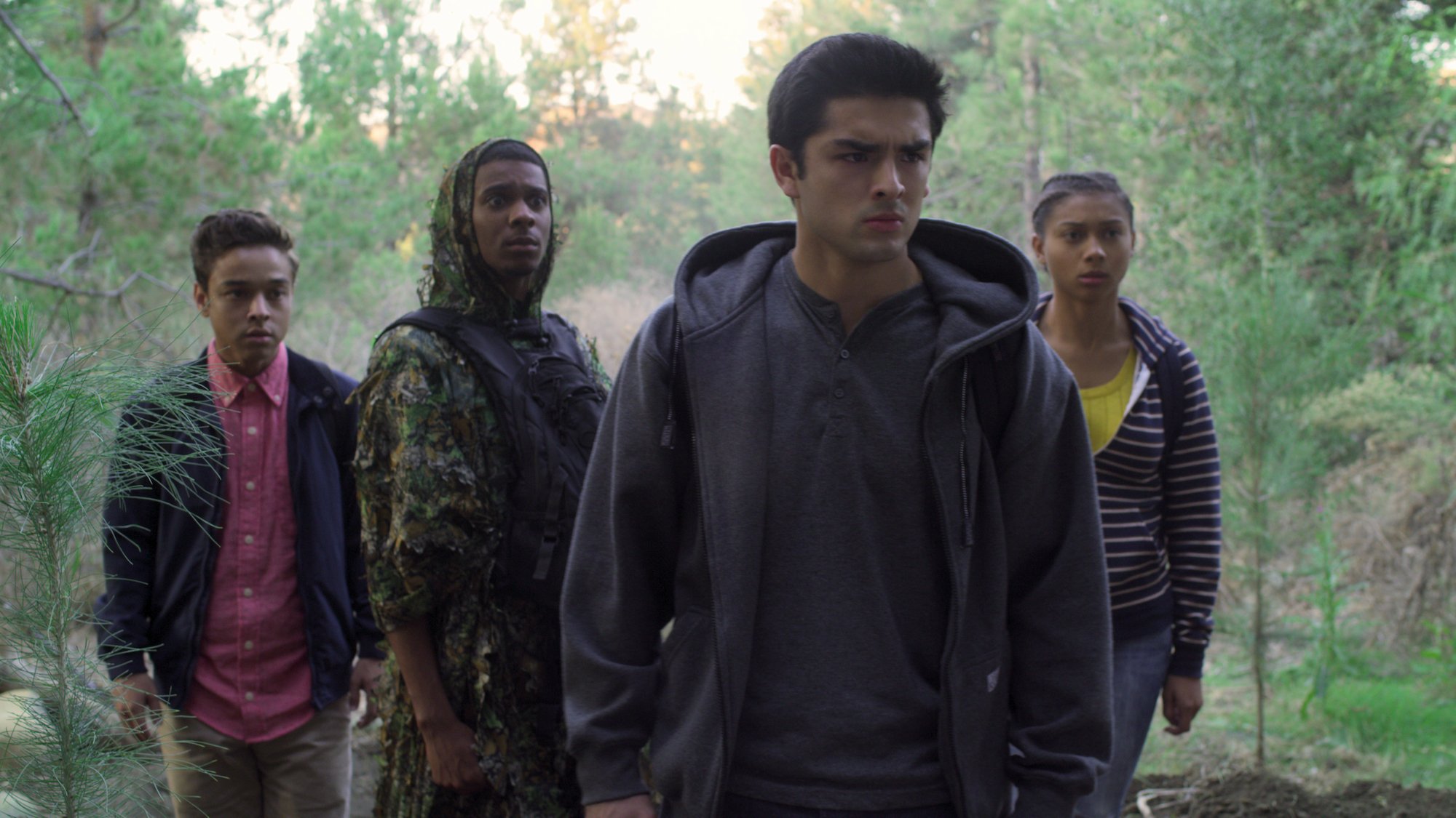 Sierra Capri, Jason Genao, Brett Gray, and Diego Tinoco standing in the woods in 'On My Block' Season 3