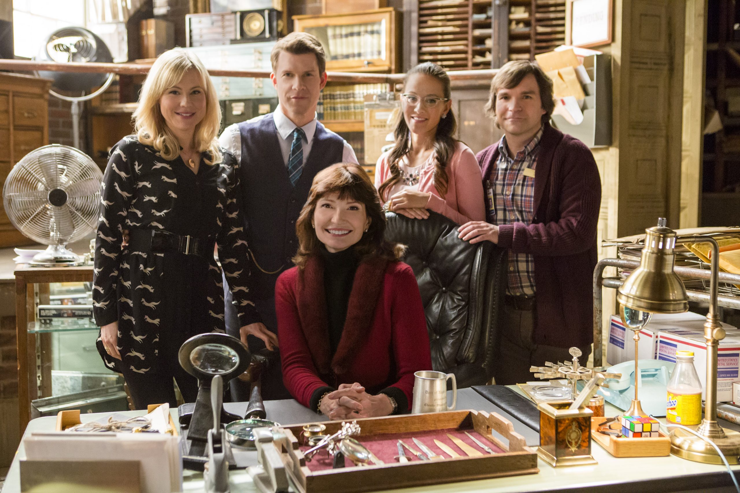 'Signed, Sealed, Delivered' Season 1 cast standing behind a desk