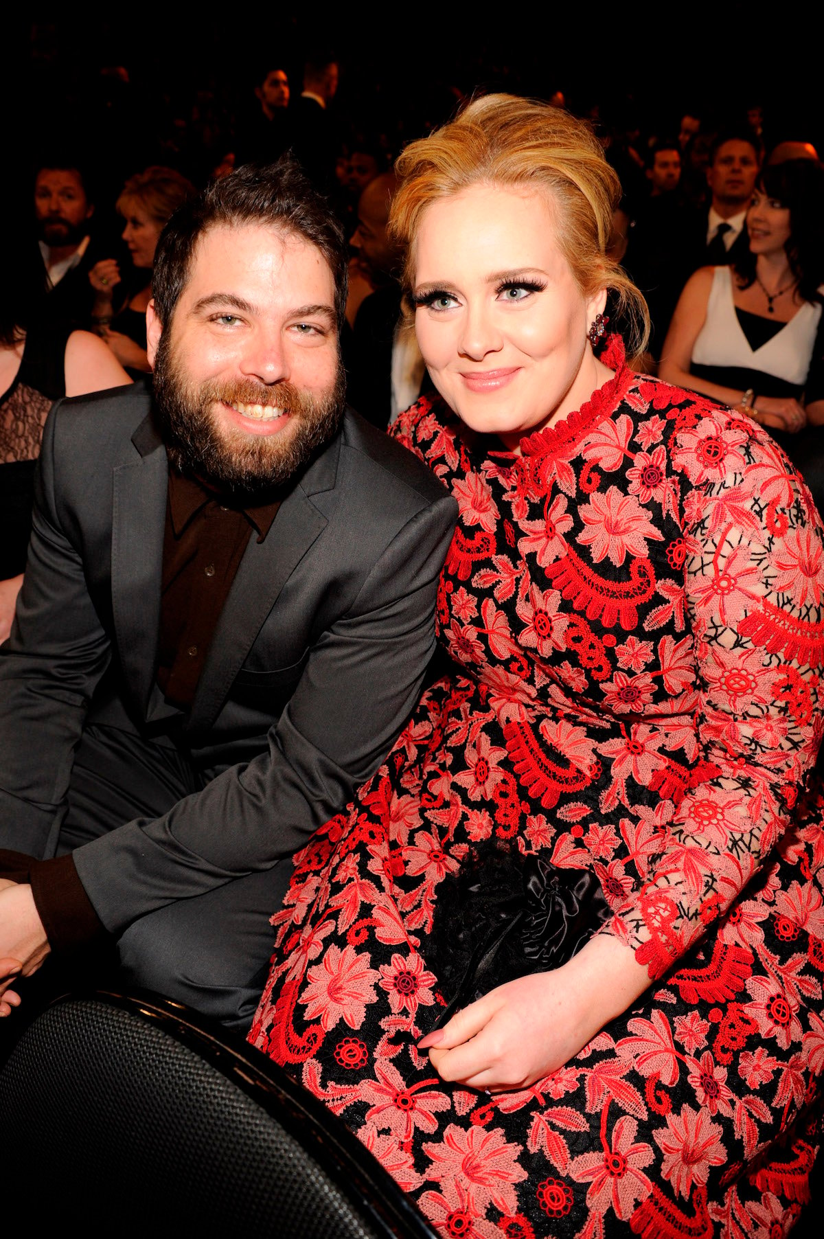 Simon Konecki and Adele sit together and smile at an event.