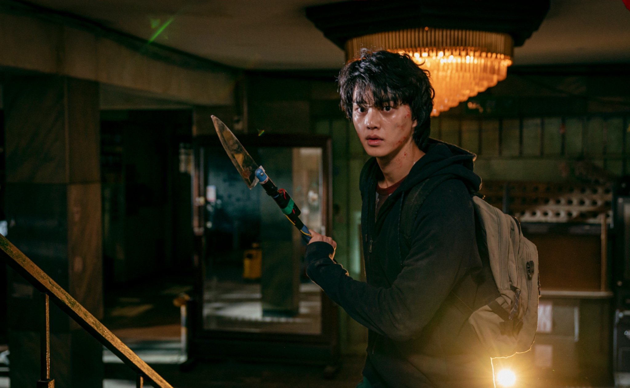 Song Kang as Cha Hyun-too for Netflix 'Sweet Home' K-drama holding knife weapon in destroyed room