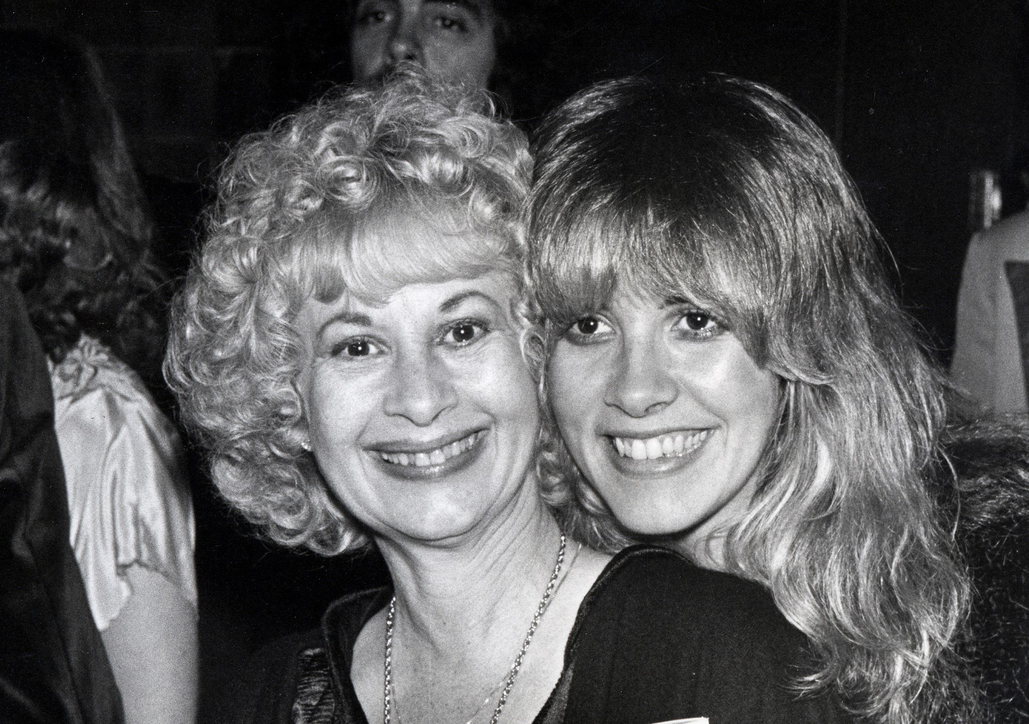 A black and white photo of Stevie Nicks and her mother Barbara Nicks posing cheek to cheek.