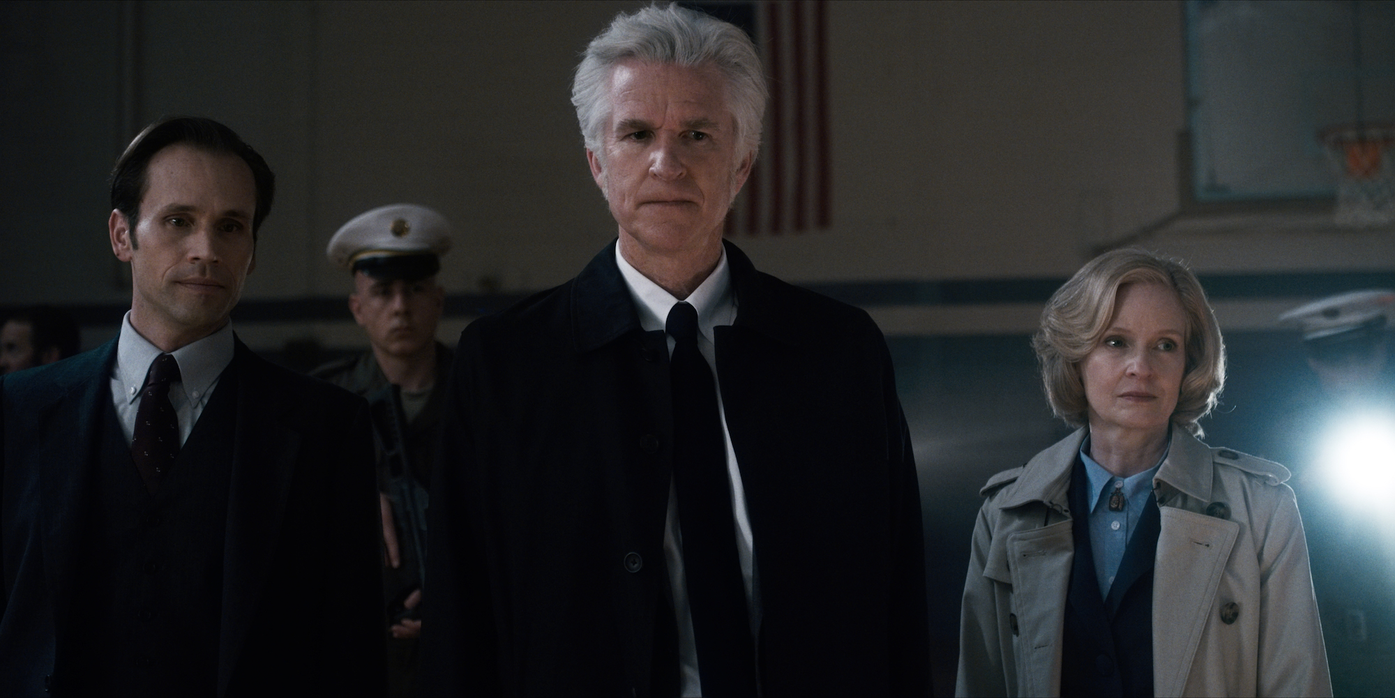 Catherine Dyer as Connie Frazier stands next to Dr. Brenner in a production still from ;Stranger Things; Season 1.