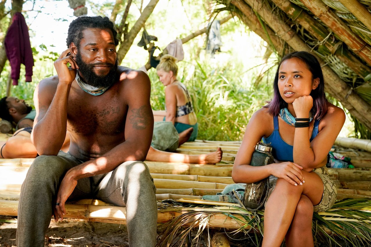 Danny McCray and Erika Casupanan on 'SURVIVOR 41' sit next to each other at camp.