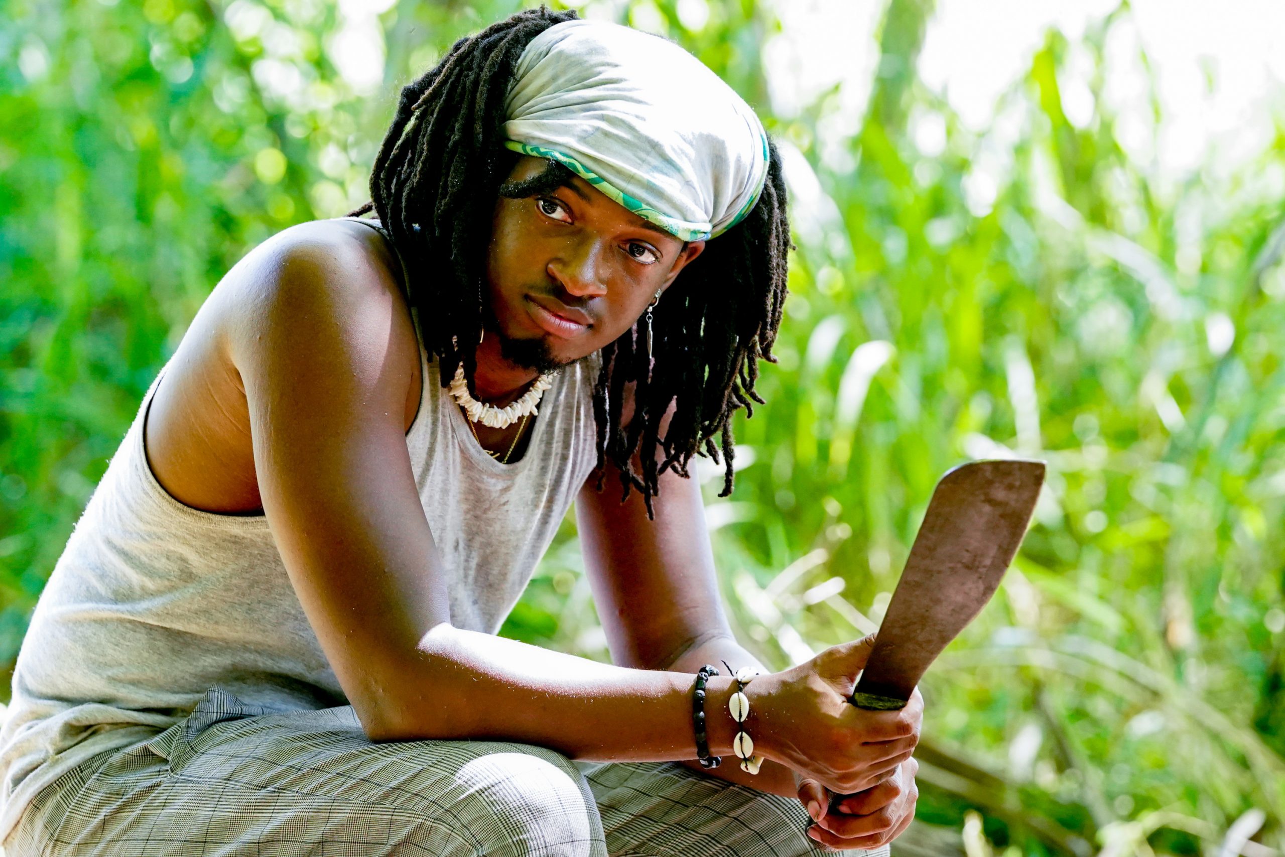 Jairus Robinson on 'Big Brother 23' sits down holding a machete.