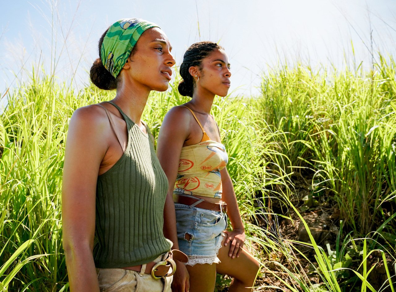 Shantel Smith and Liana Wallace on 'SURVIVOR 41' stand next to each other in a field.