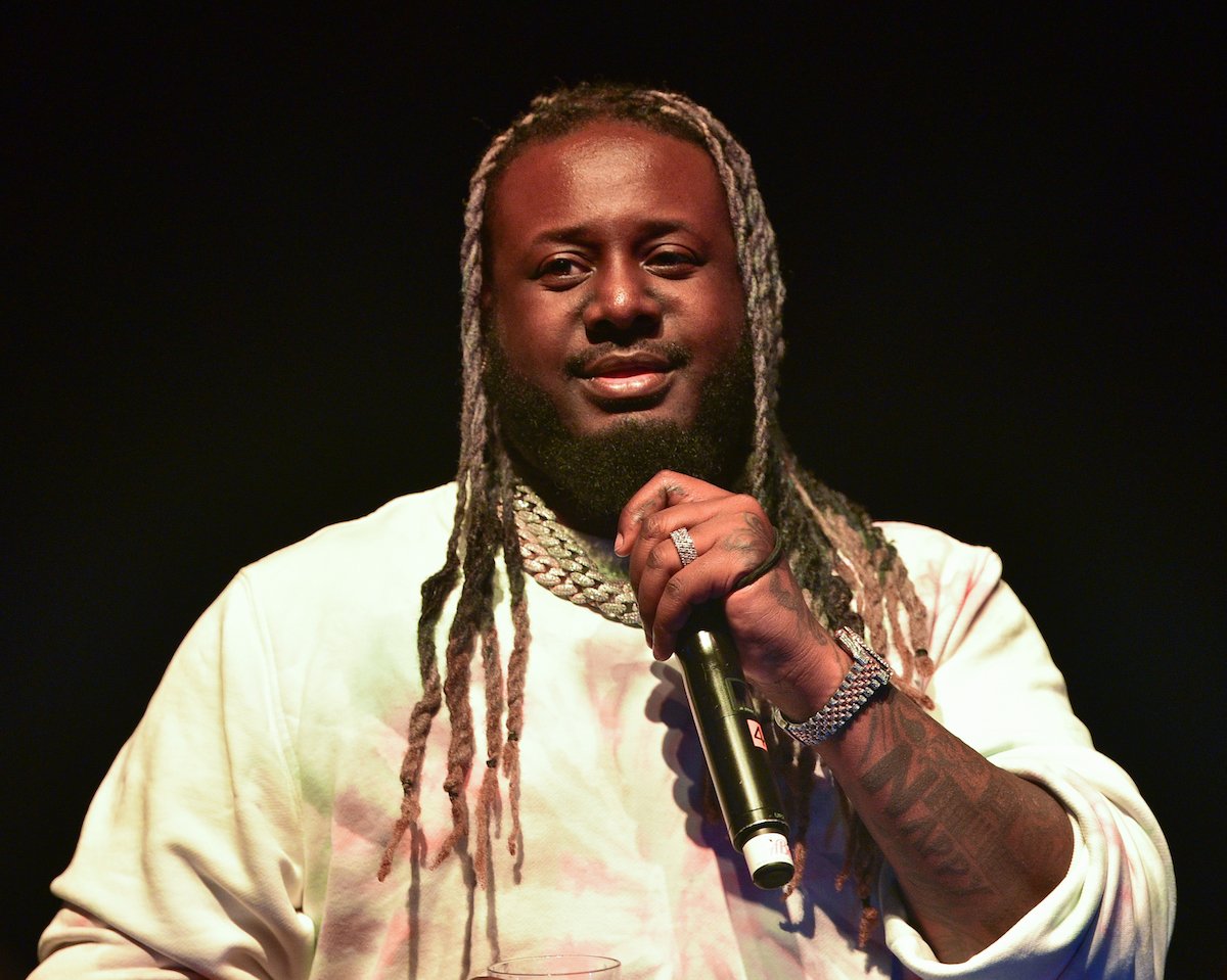 T-Pain holding a mic