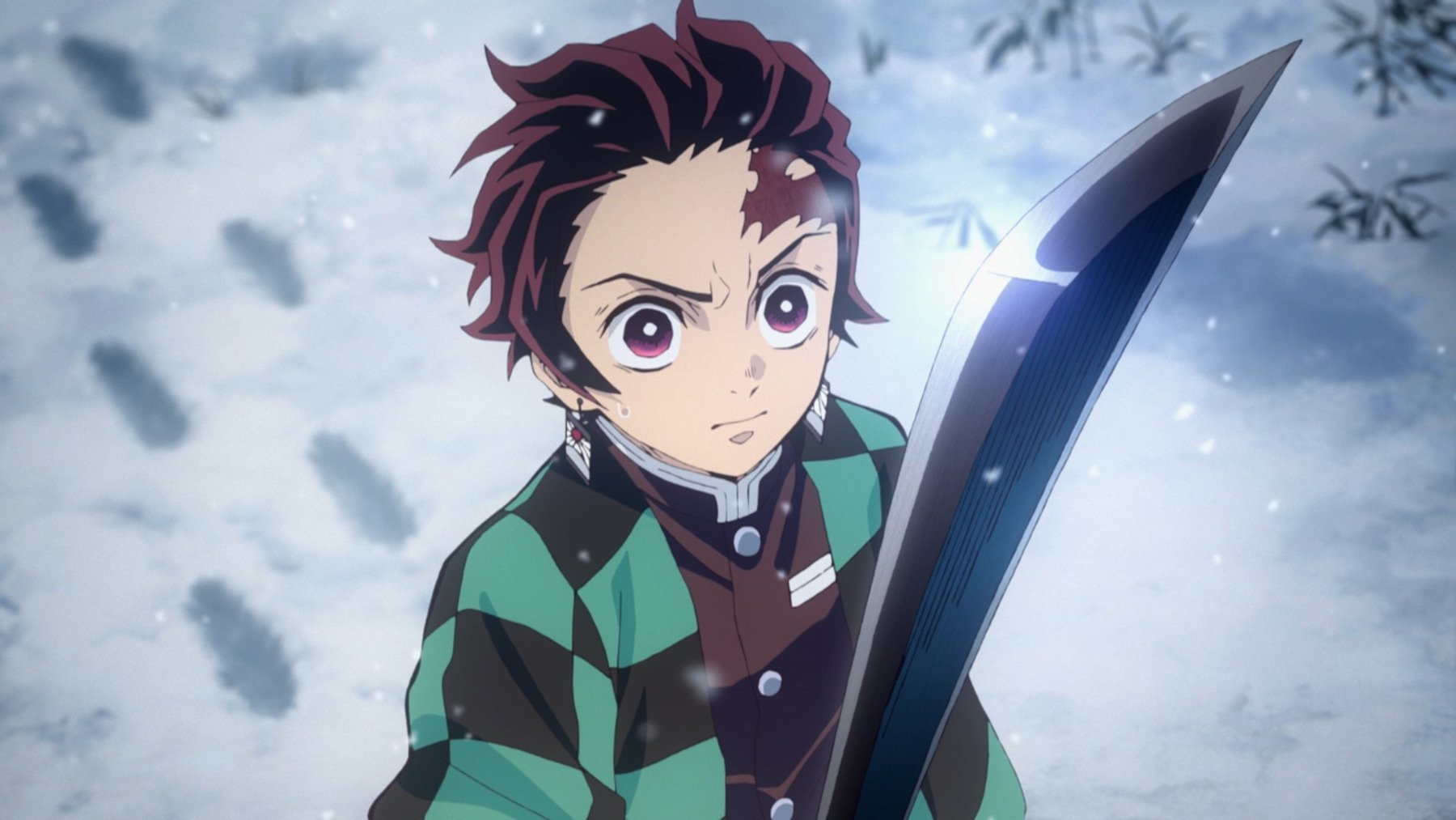 Tanjiro holding his sword in the snow in 'Demon Slayer' Season 2's Mugen Train Arc Episode 4.
