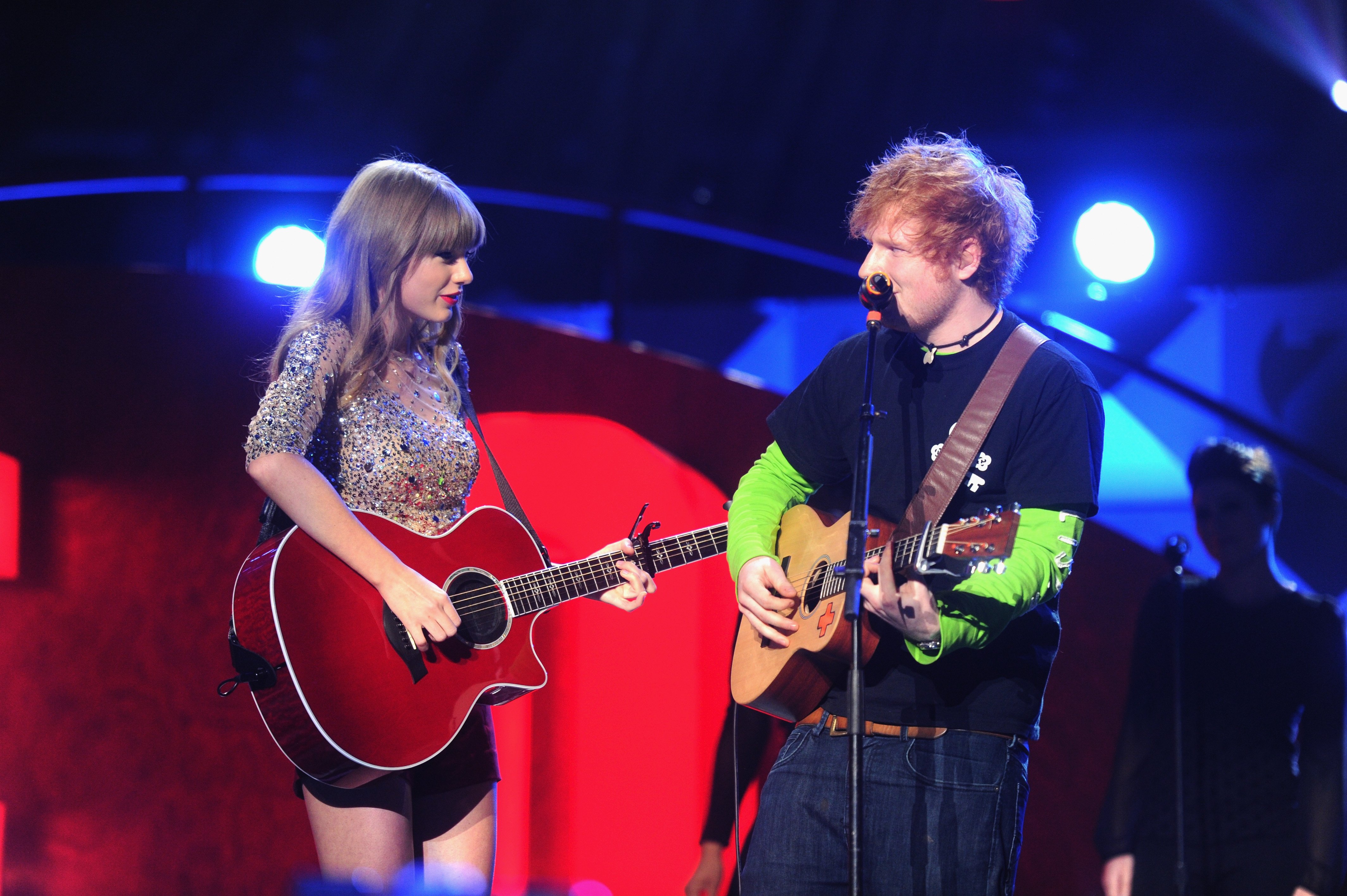 Taylor Swift and Ed Sheeran perform on stage during Z100's Jingle Ball 2012