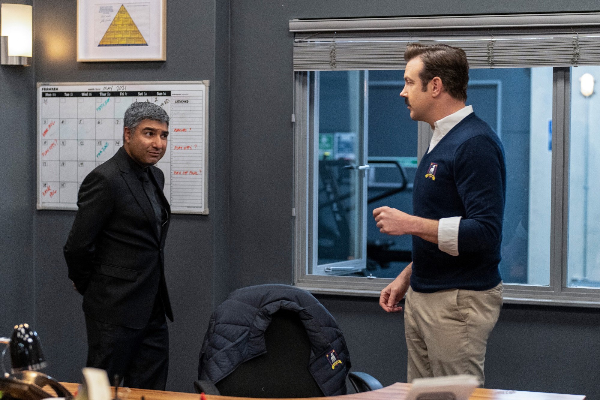 Nate and Ted Lasso stand in an office in season 2 of 'Ted Lasso'