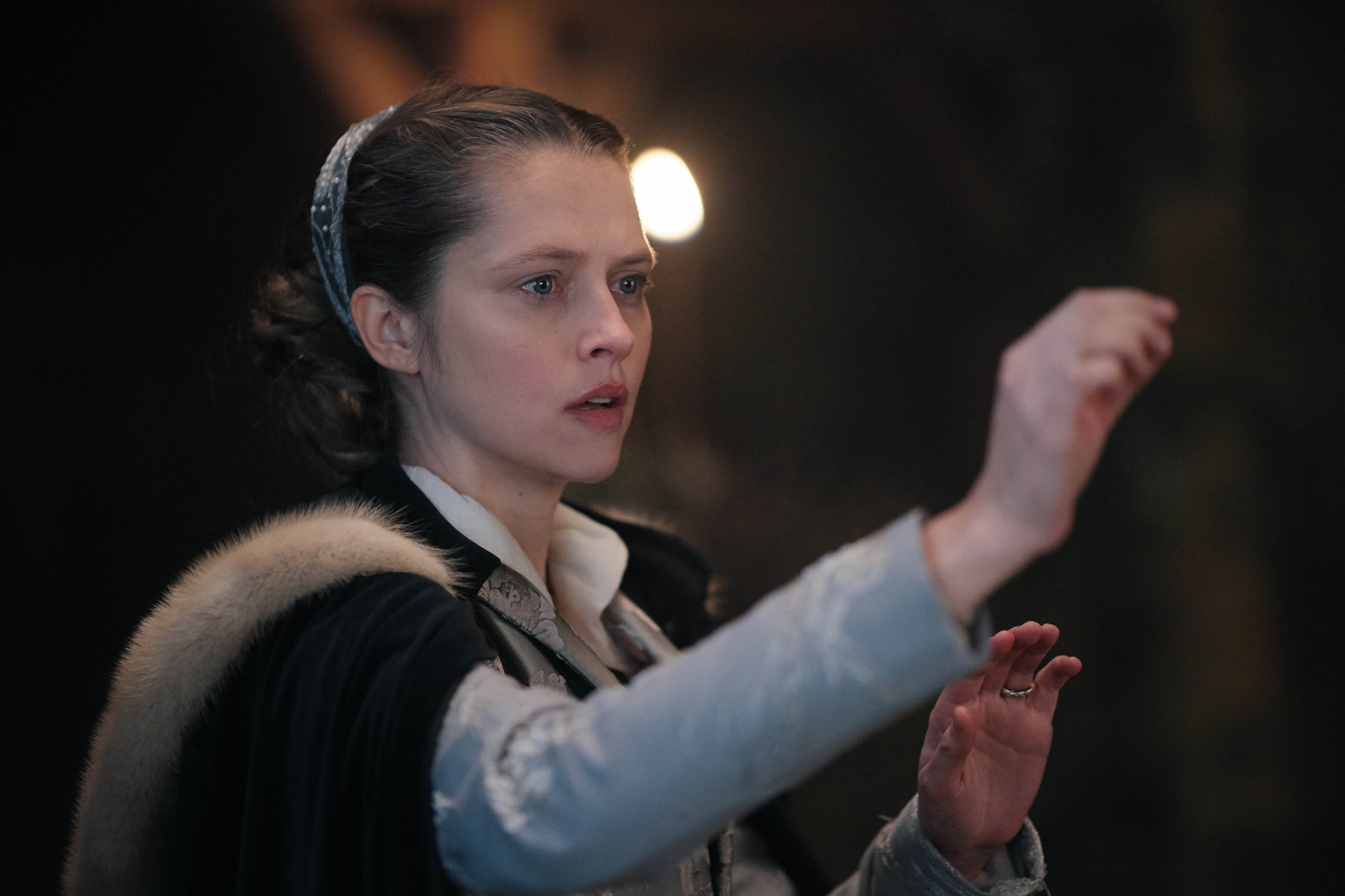Diana Bishop, wearing a 16th century dress and doing magic in 'A Discovery of Witches'