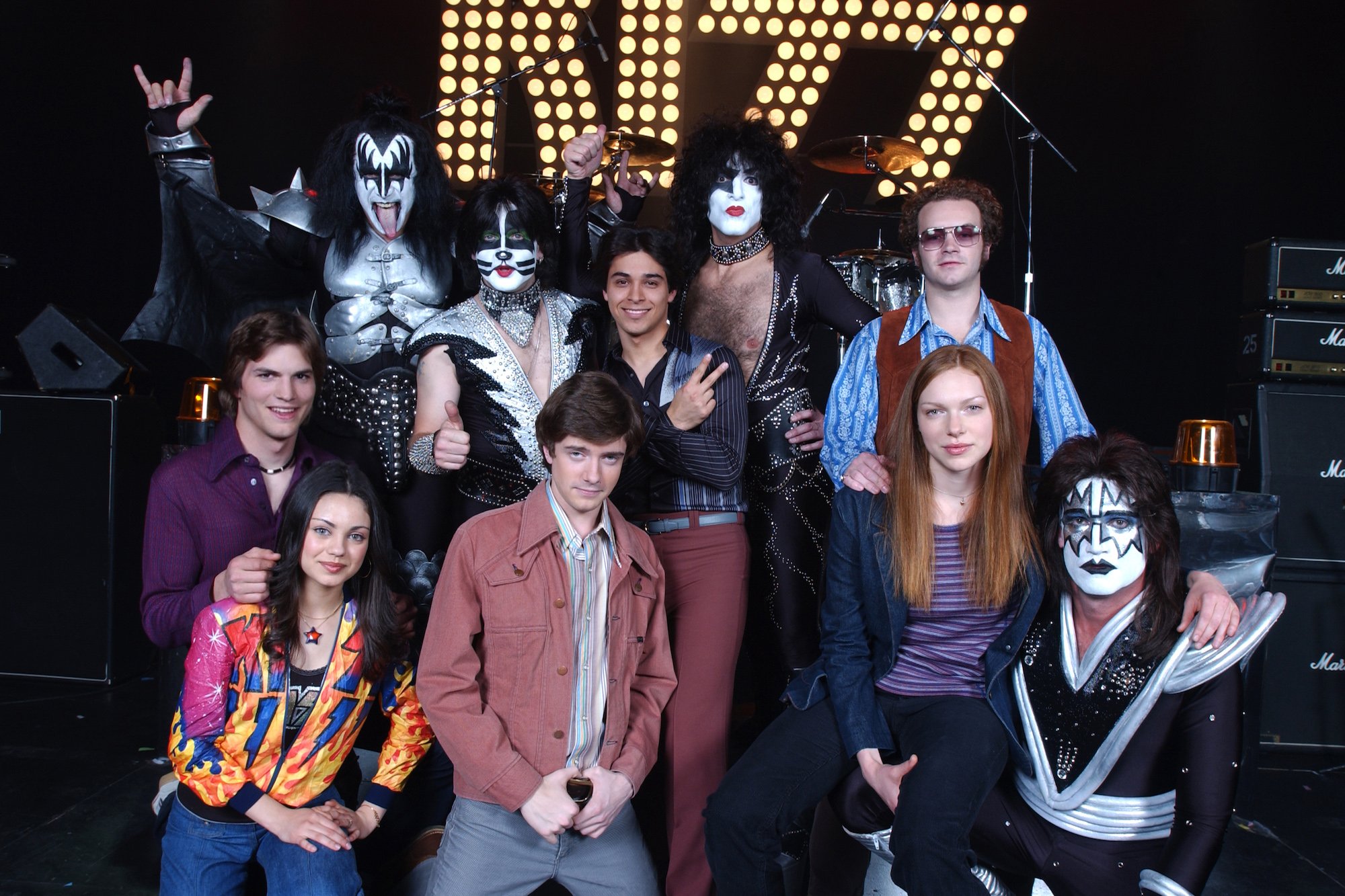 The cast from 'That 70s Show' posing with the rock band Kiss