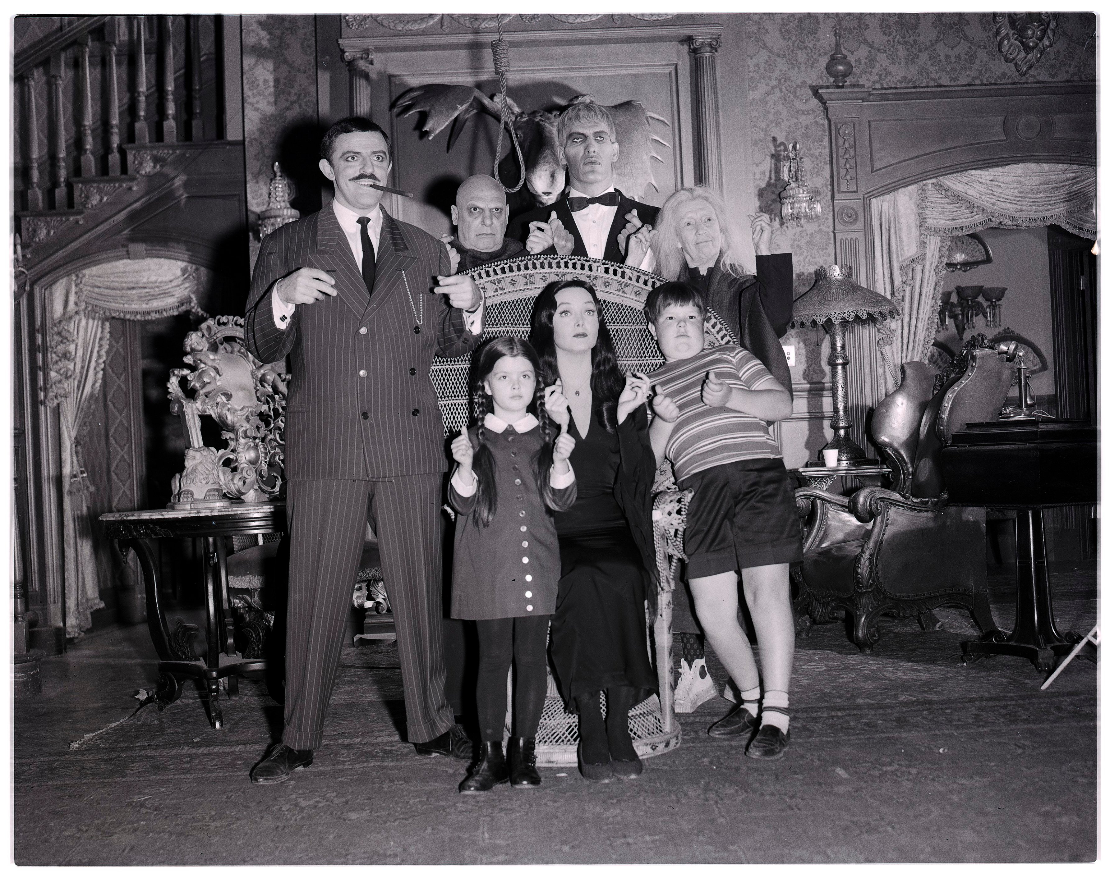 Black and white image of the cast of the sitcom 'The Addams Family.'