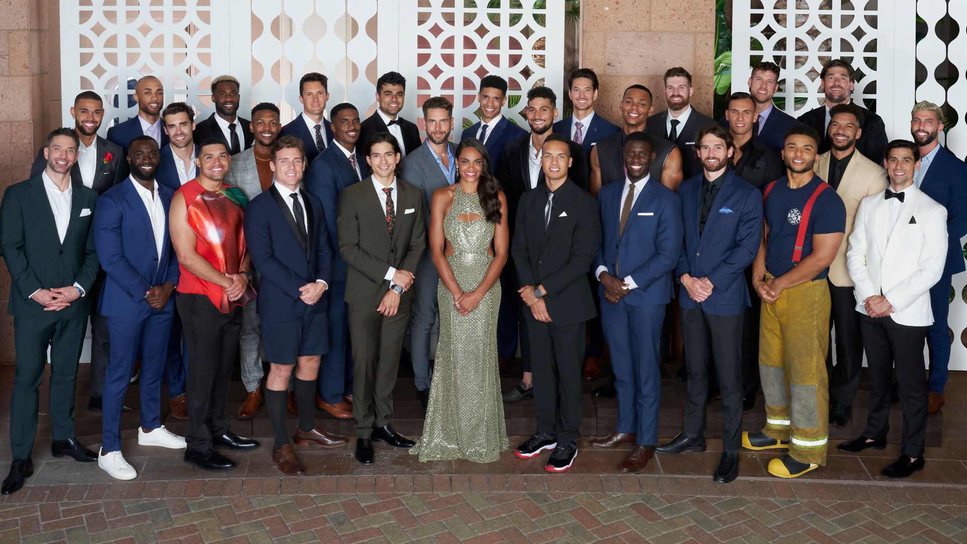 ‘The Bachelorette’ Season 18 cast members Joe, Mollique, Alec, Pardeep, Romeo, Garrett, Chris G., Clayton, Bryan, Nayte, Rick, Spencer, Pj, Casey, Will, Jomarri, Peter, Jamie, Martin, Lt, Olu, Rodney, Chris S., Edward, Michelle Young, Brandon J., Leroy, Brandon K., Daniel, and Jack pose with Michelle Young in 2021