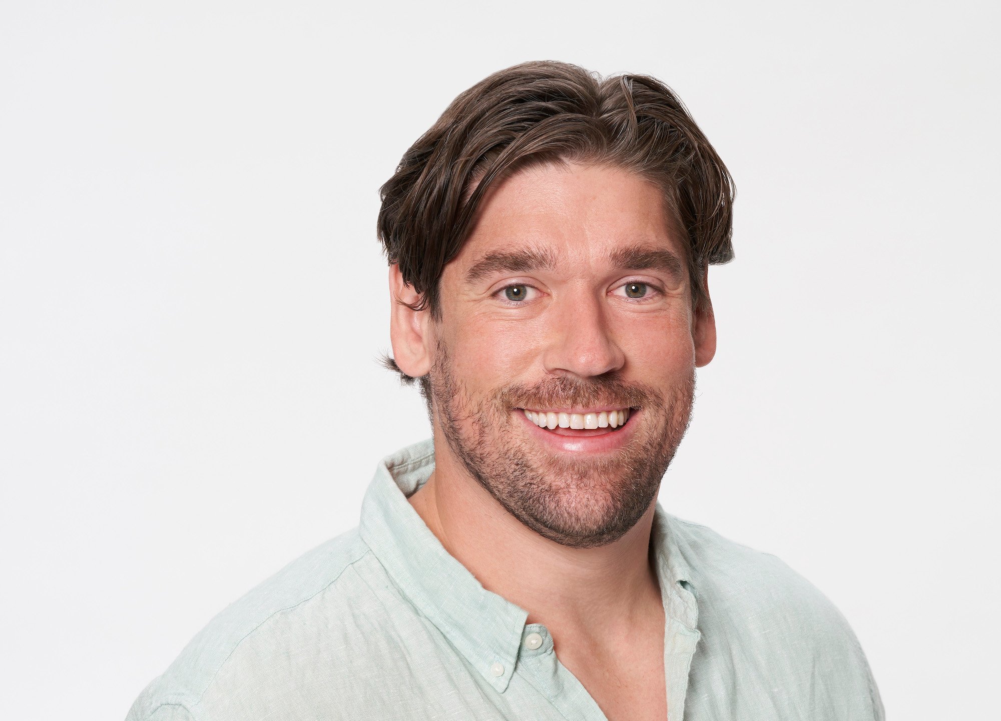 Bryan Witzmann in a light green button down for his profile photo for 'The Bachelorette' Season 18 with Michelle Young