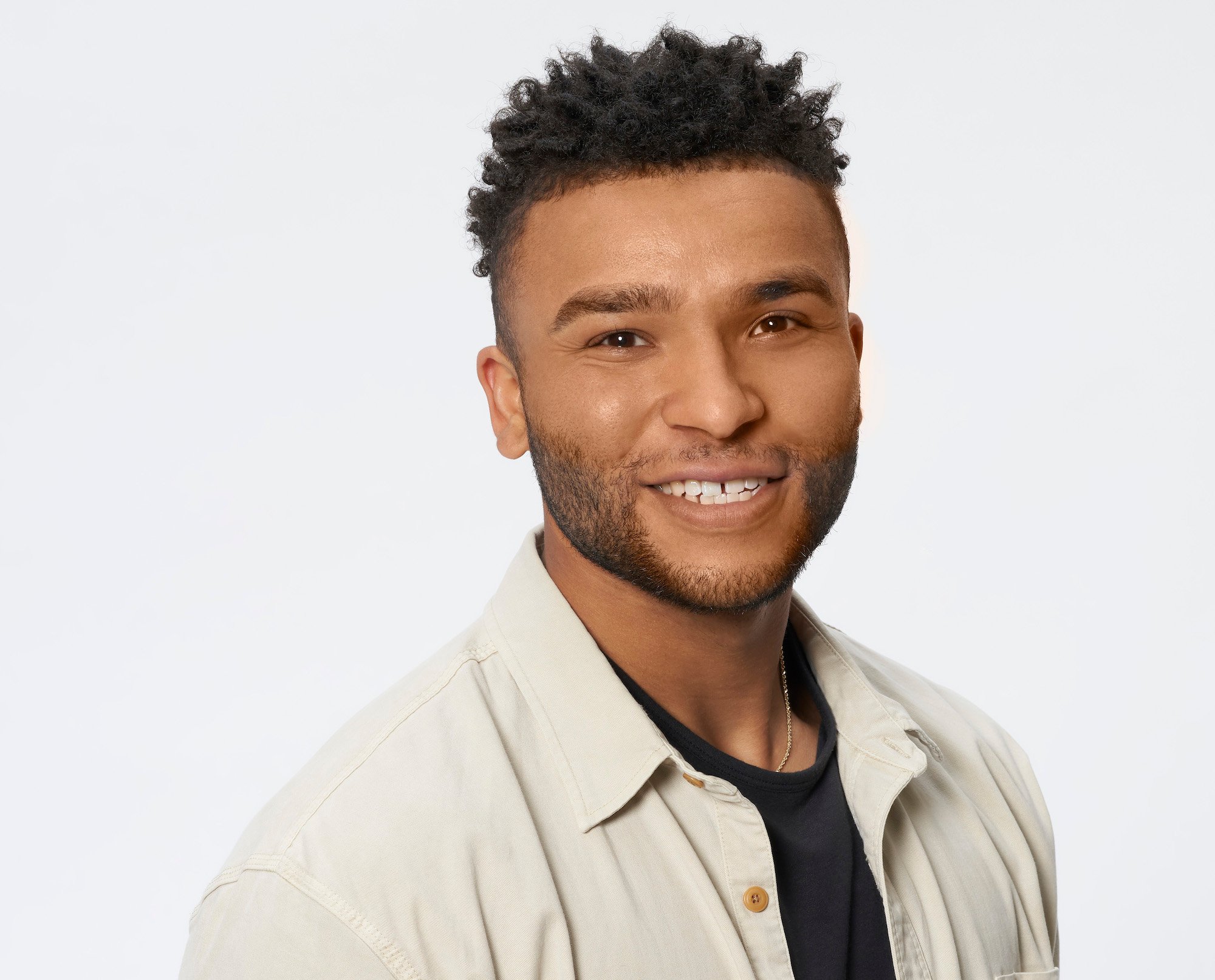 Daniel Tully wearing a black tshirt and khaki button down in his profile photo for Michelle Young's season of 'The Bachelorette.'