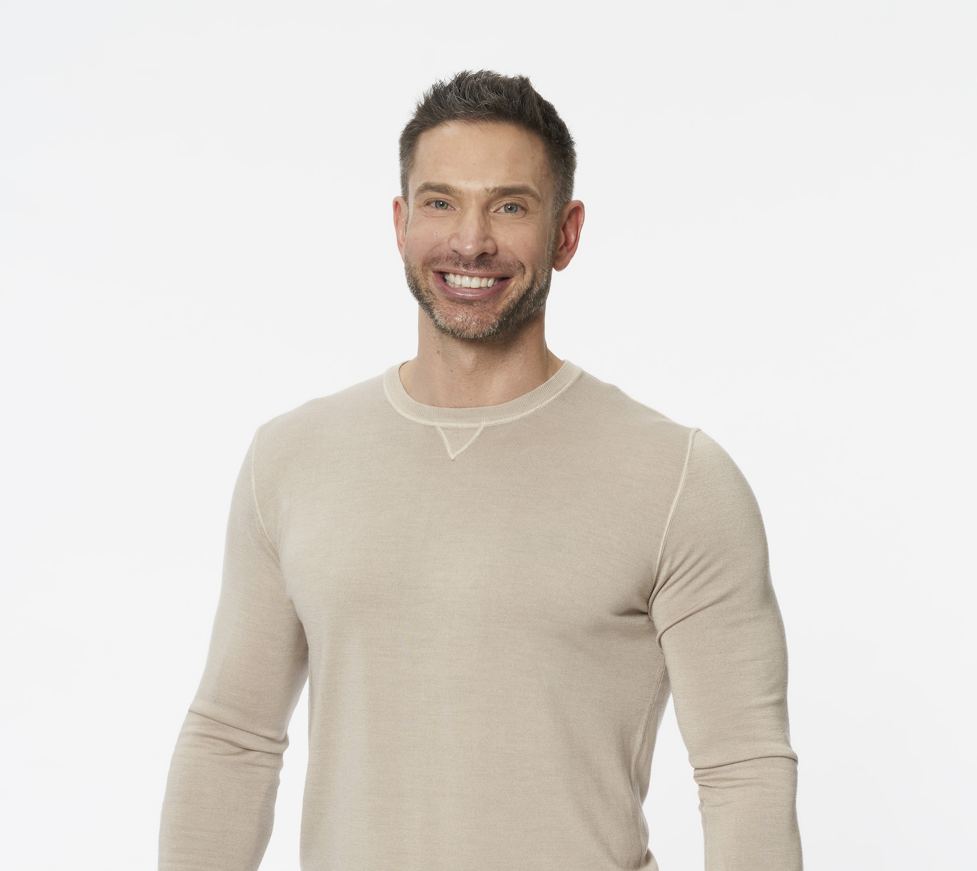 Lowell 'LT' Murray IV in a beige sweater for his profile photo for 'The Bachelorette' Season 18 with Michelle Young