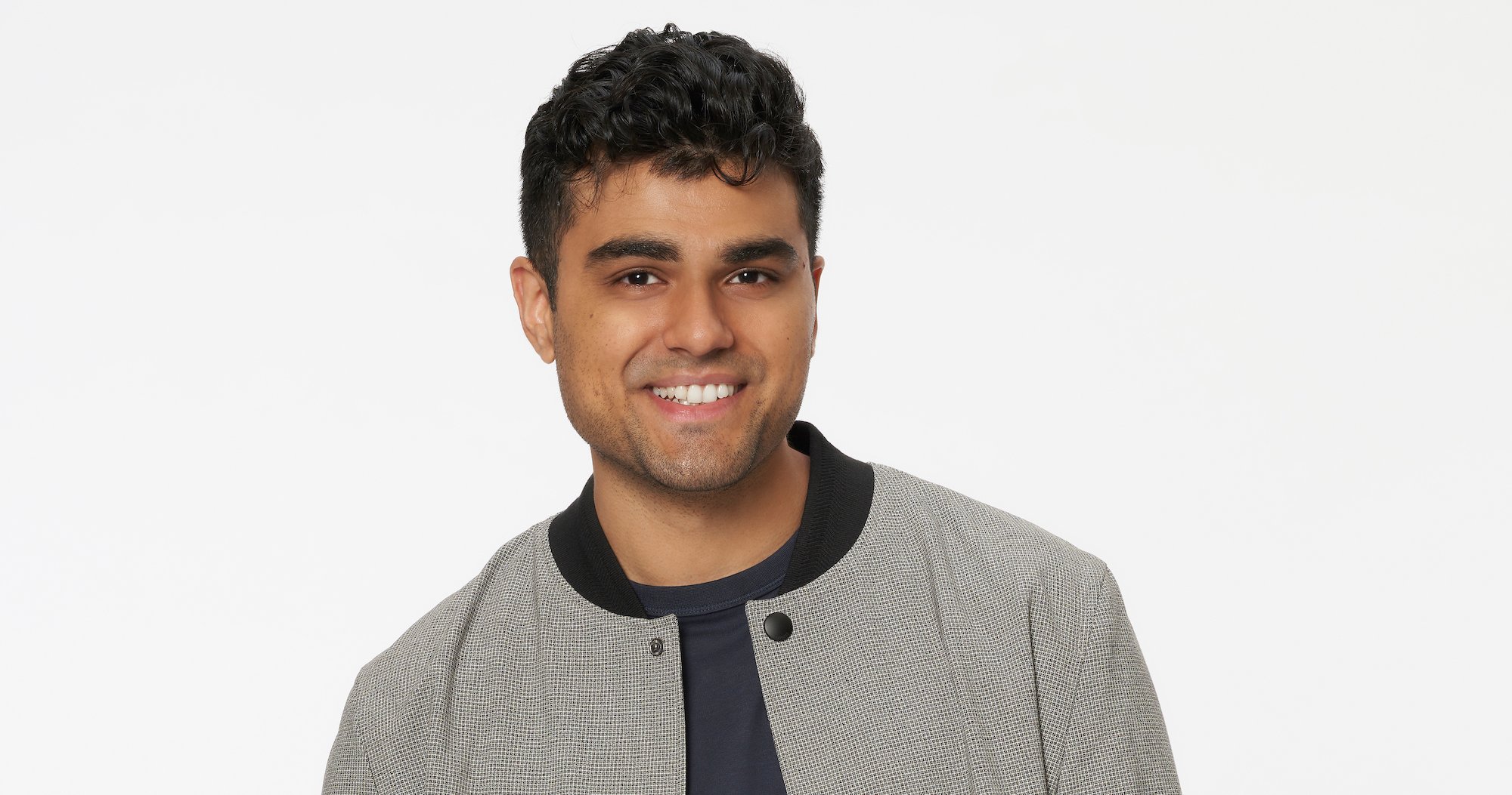 Pardeep in his profile photo for 'The Bachelorette' wearing a gray jacket and black tshirt.