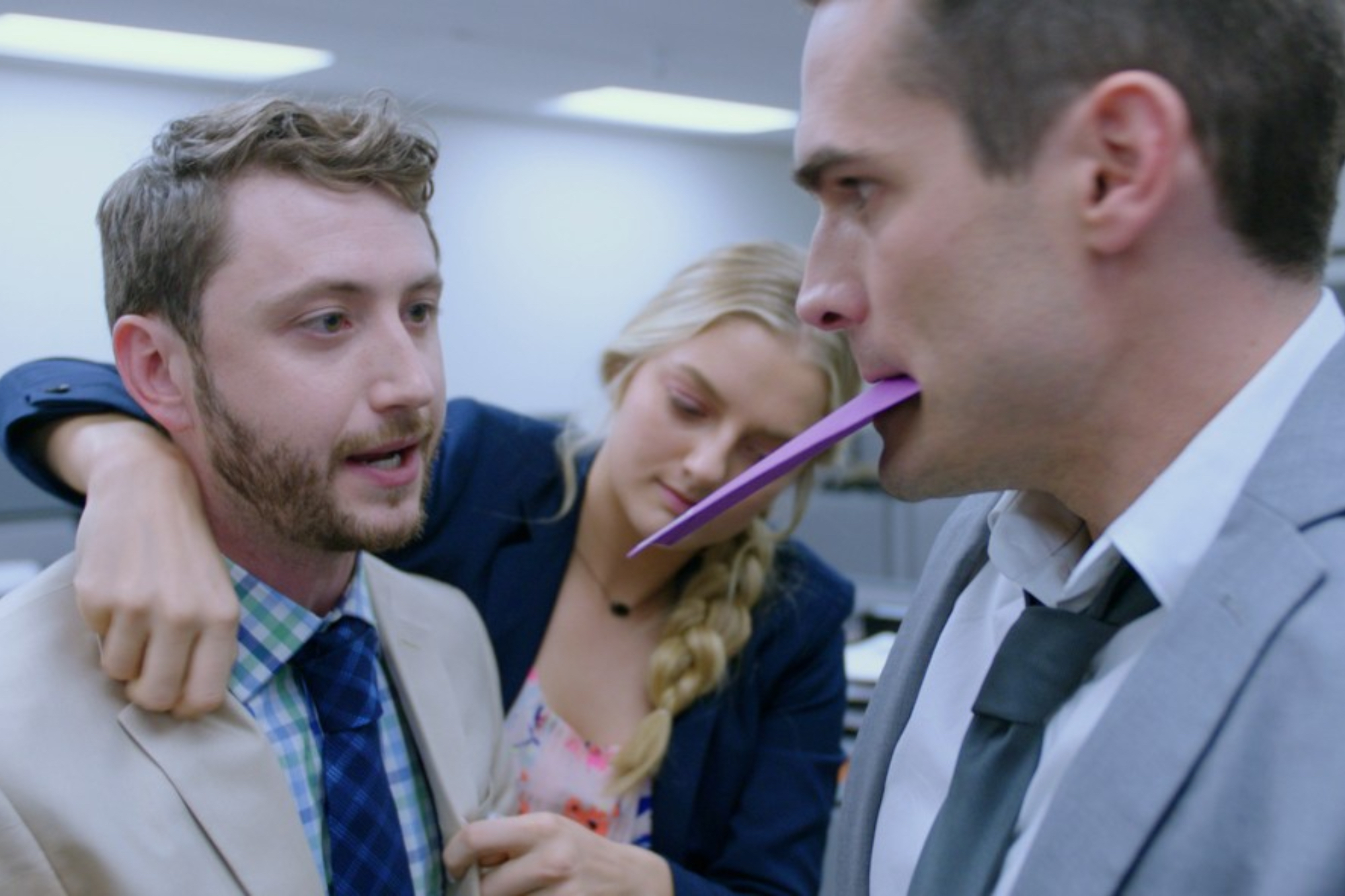 PJ McCabe as PJ and Jim Cummings as Jordan talking with a purple letter in his mouth while Jacquelin Doke as Jaclyn fixes PJ's clothes