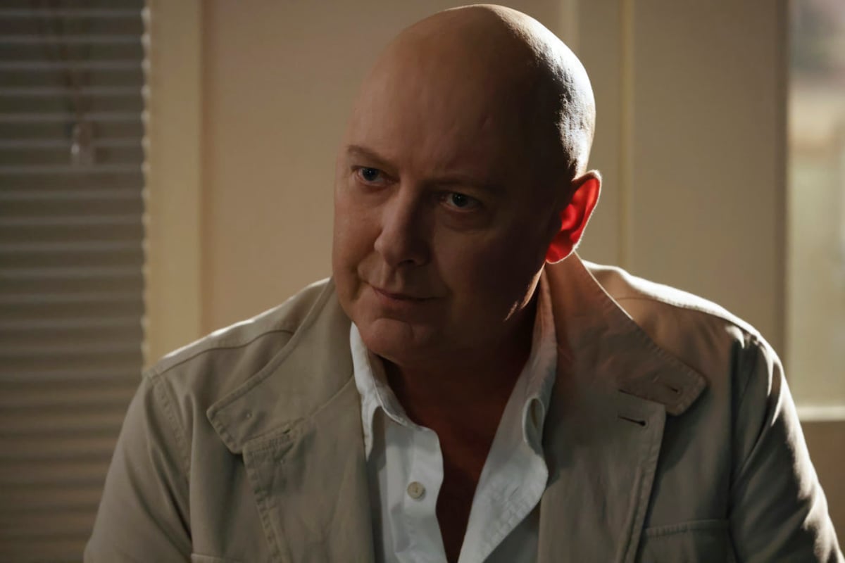 James Spader as Raymond "Red" Reddington in The Blacklist Season 9. Reddington is wearing a tan jacket and white button-down shirt.