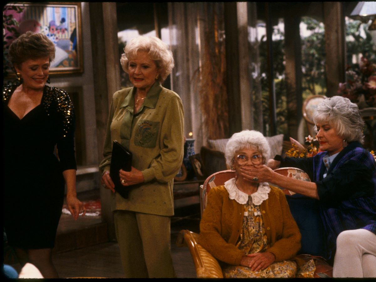 The Golden Girls on set, Rue McClanahan, Betty White, Estelle Getty, and Bea Arthur.