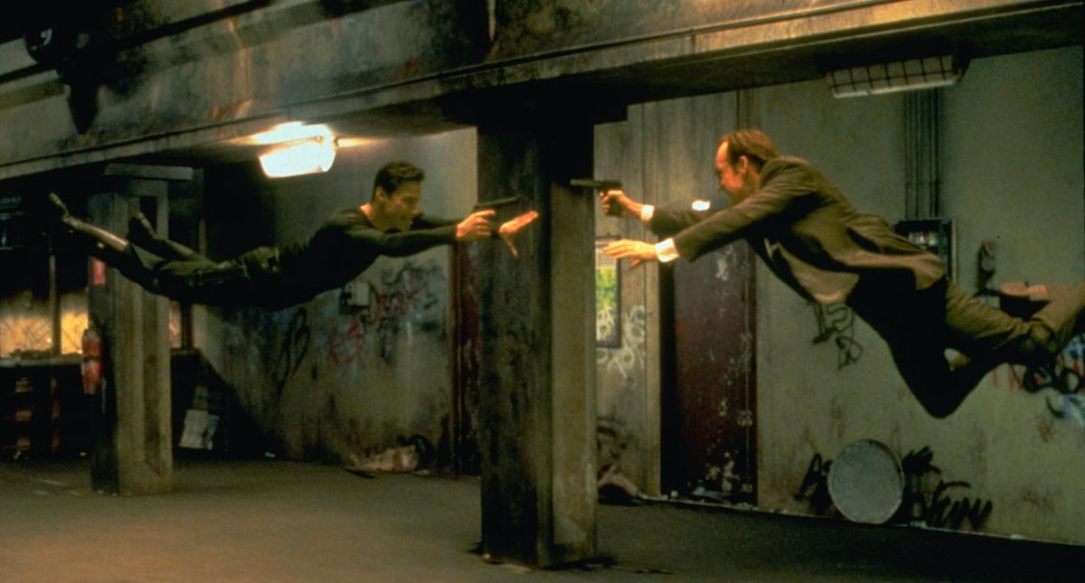 Keanu Reeves and Hugo Weaving floating in a scene from 'The Matrix'