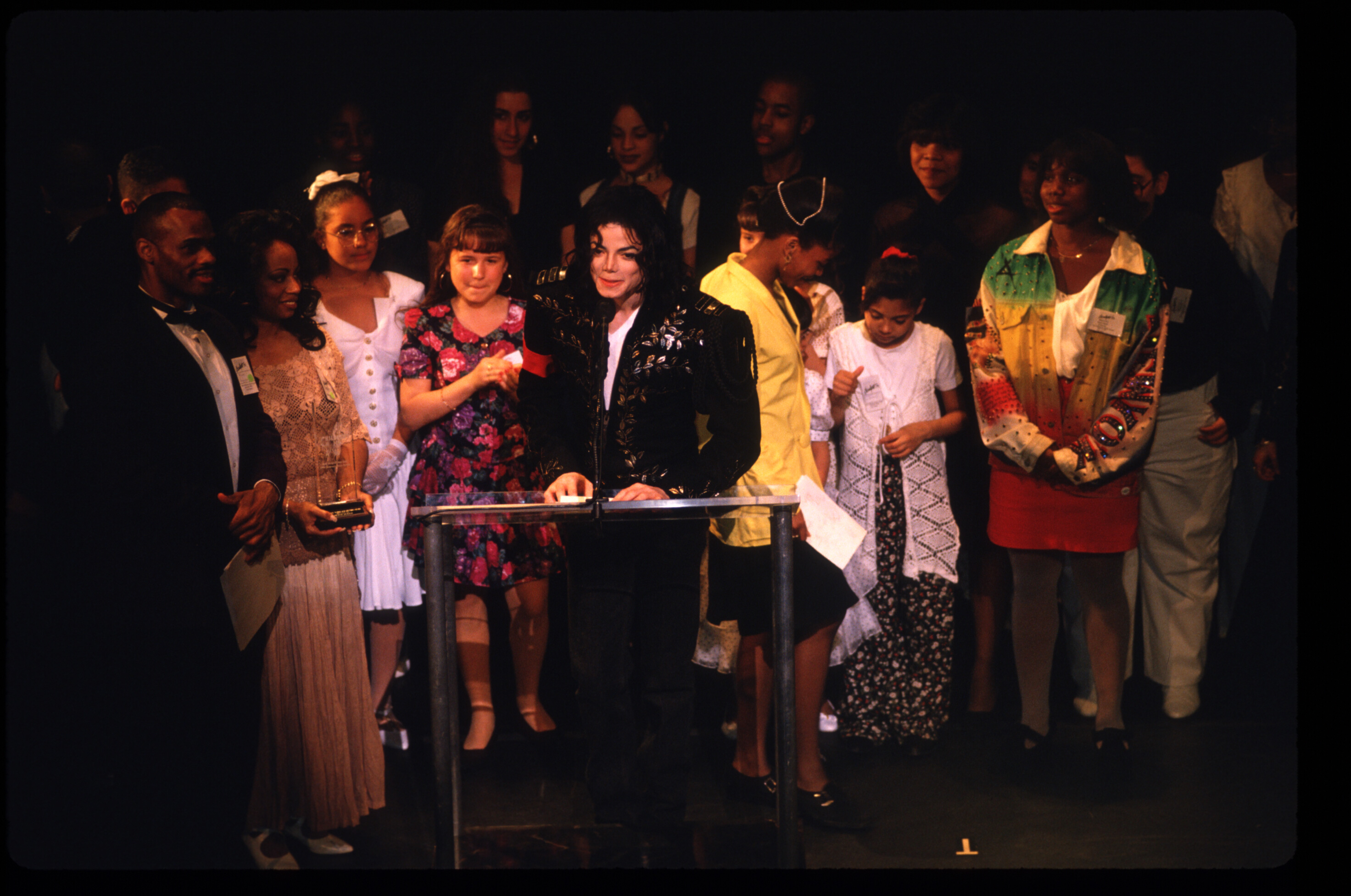 Entertainer Michael Jackson accepts an award at the 'Caring For Kids' ceremony