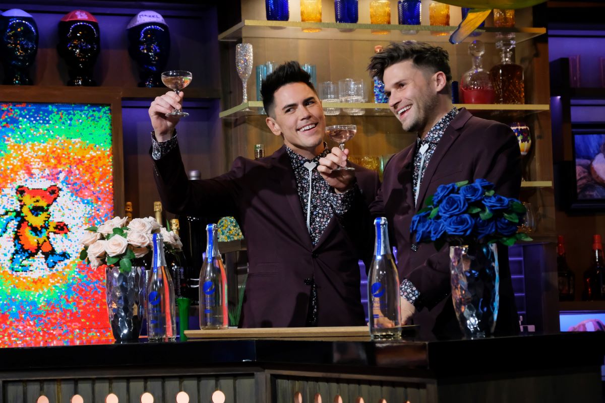 Tom Sandoval and Tom Schwartz in matching suits, raising glasses