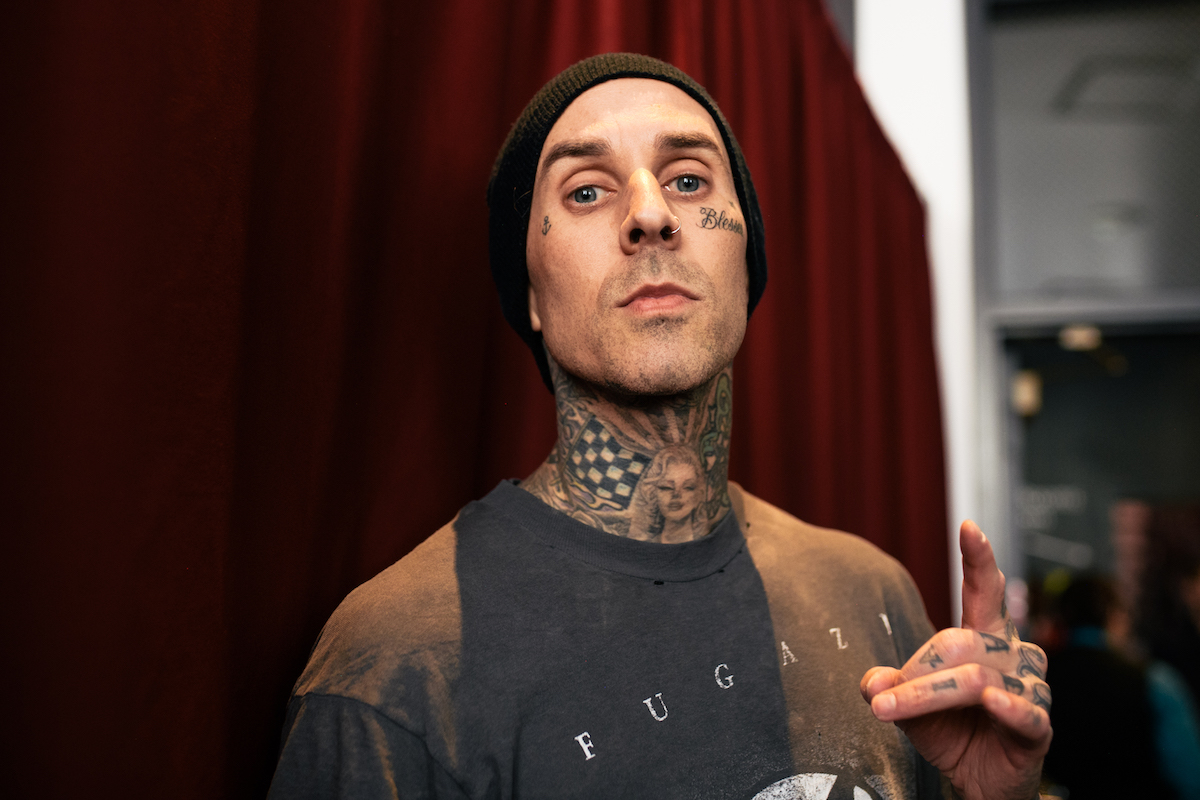 Close-up of Travis Barker's face at an event.