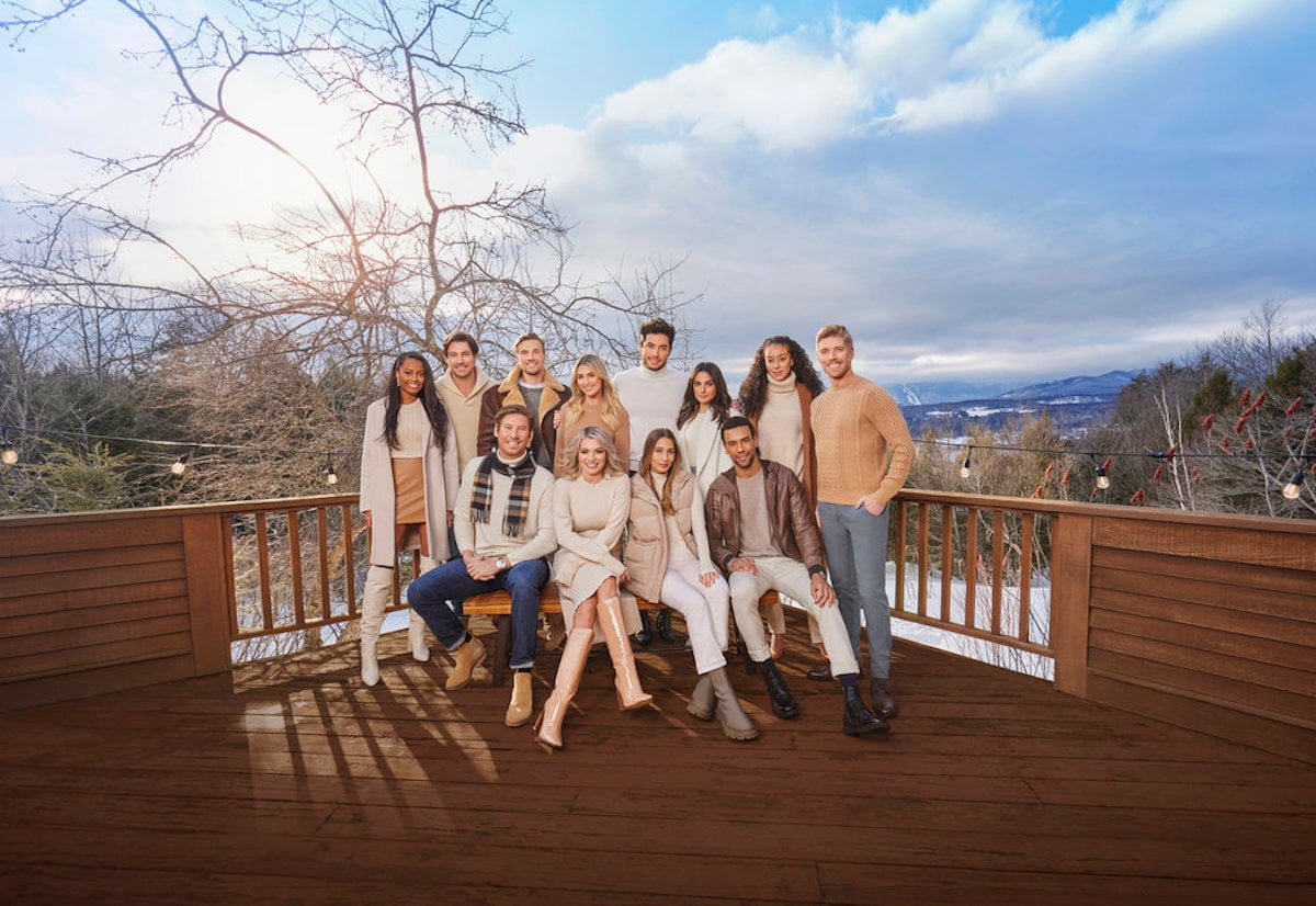 Ciara Miller, Craig Conover, Austen Kroll, Luke Gulbranson, Julia McGuire, Lindsay Hubbard, Andrea Denver, Amanda Batula, Paige DeSorbo, Jason Felton, Gabrielle Kniery, and Kyle Cooke pose in front of a snowy landscape in a promotional image for 'Winter House