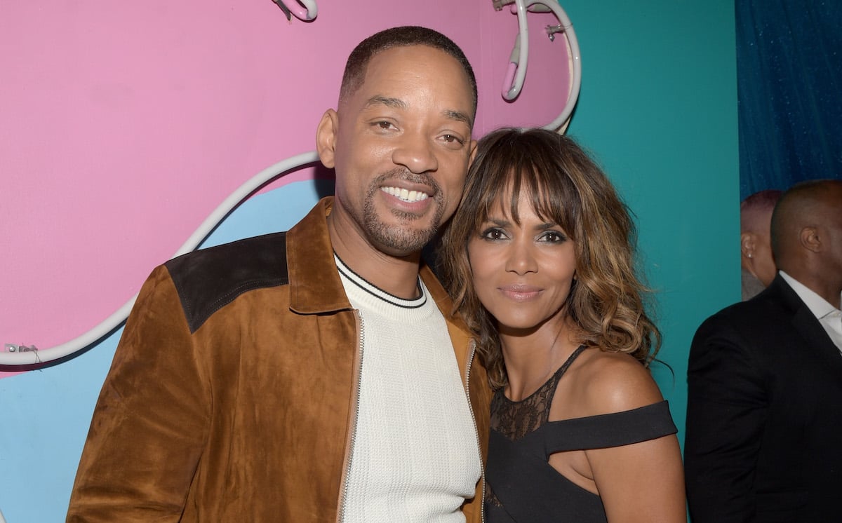 Will Smith and Halle Berry smile for the camera at an event.