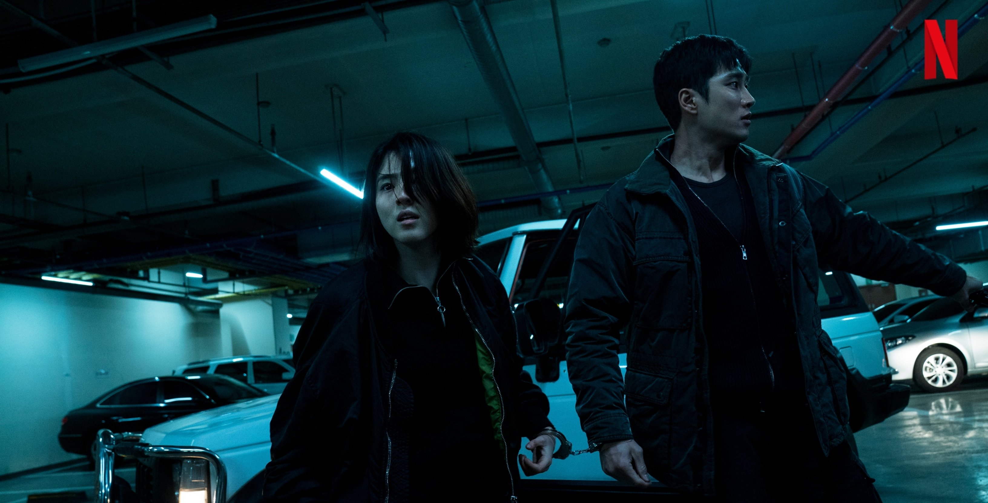 Yoon Ji-woo and Jeon Pil-do for 'My Name' K-drama romance wearing dark clothing in parking garage