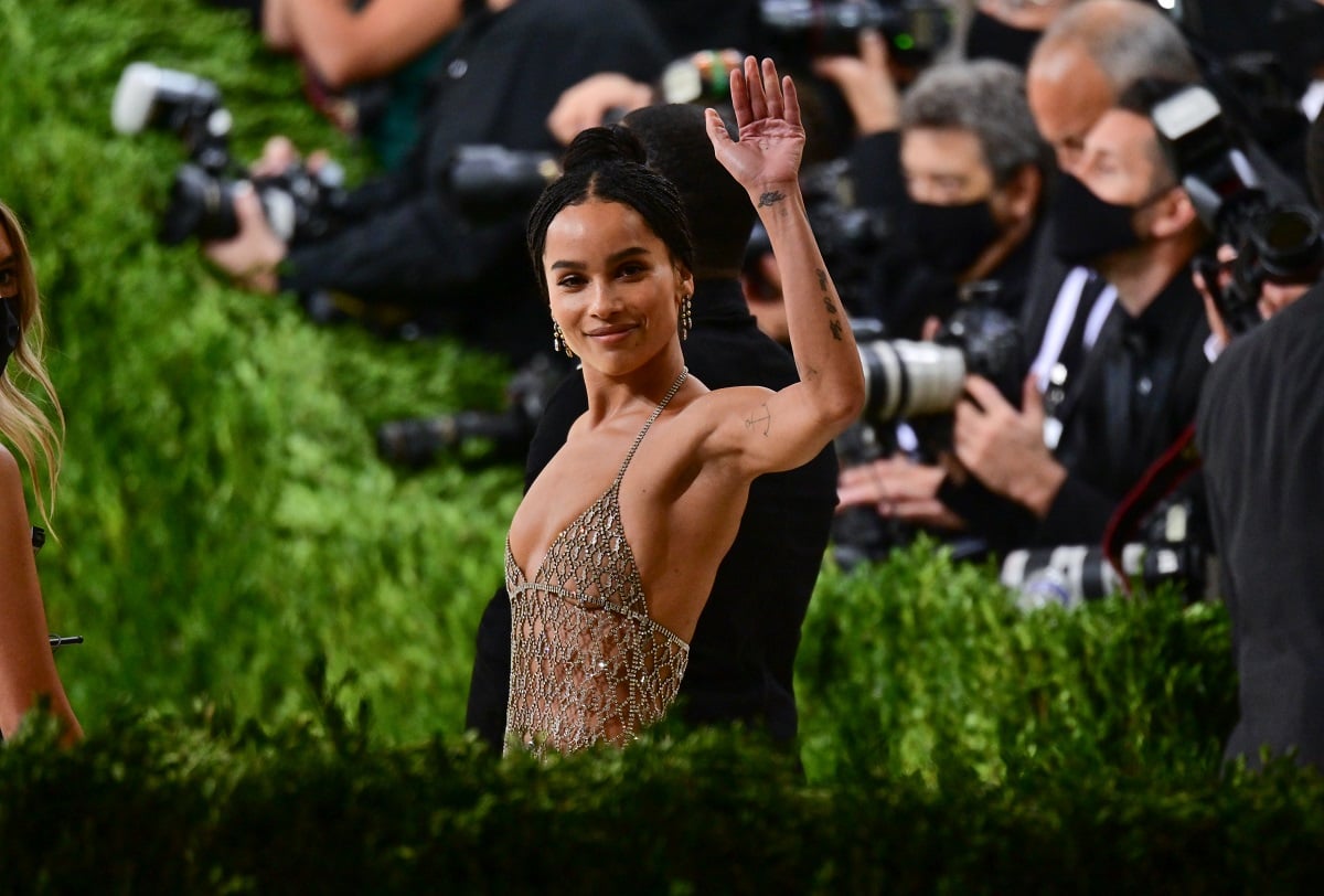 Zoe Kravitz waving in a dress