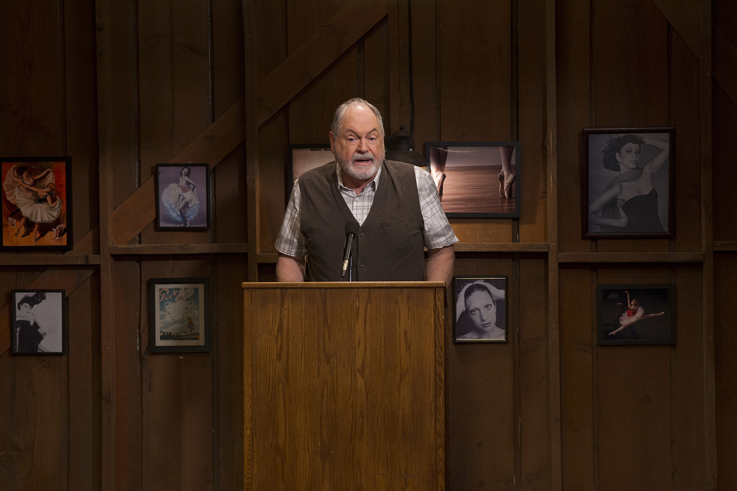 Michael Winters as Taylor Doose hosting a town meeting in Gilmore Girls: A Year in the Life