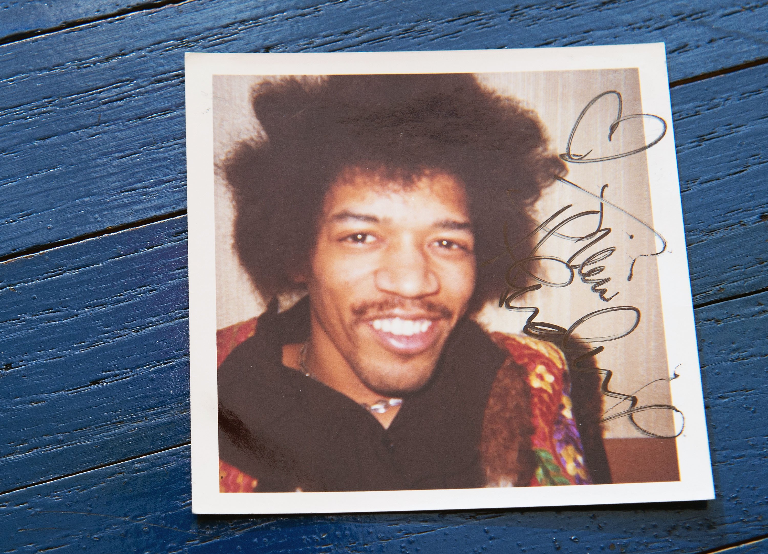 A Jimi Hendrix photograph on a blue table