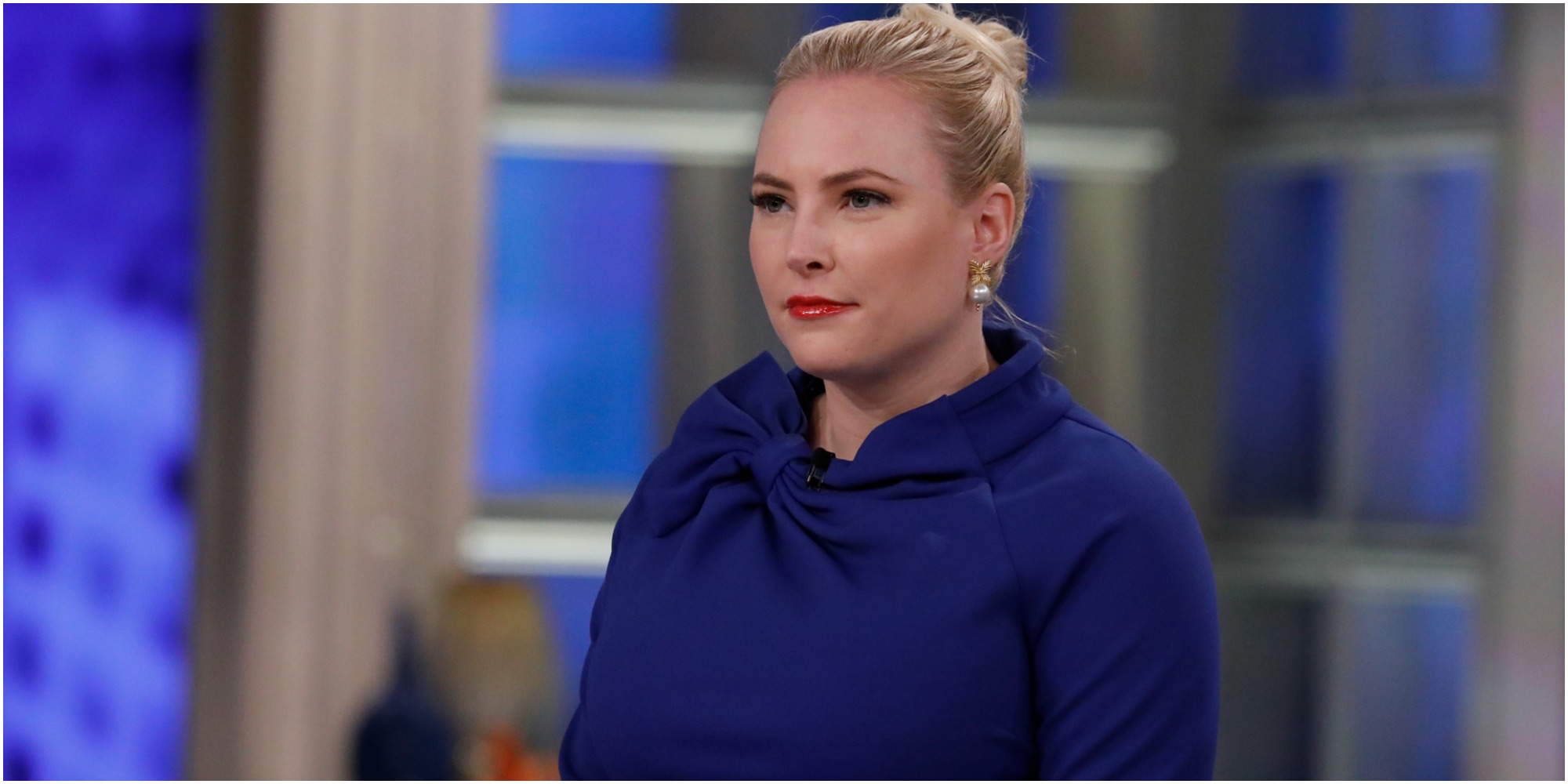 Meghan McCain sits on the panel of "The View" wearing a blue dress.