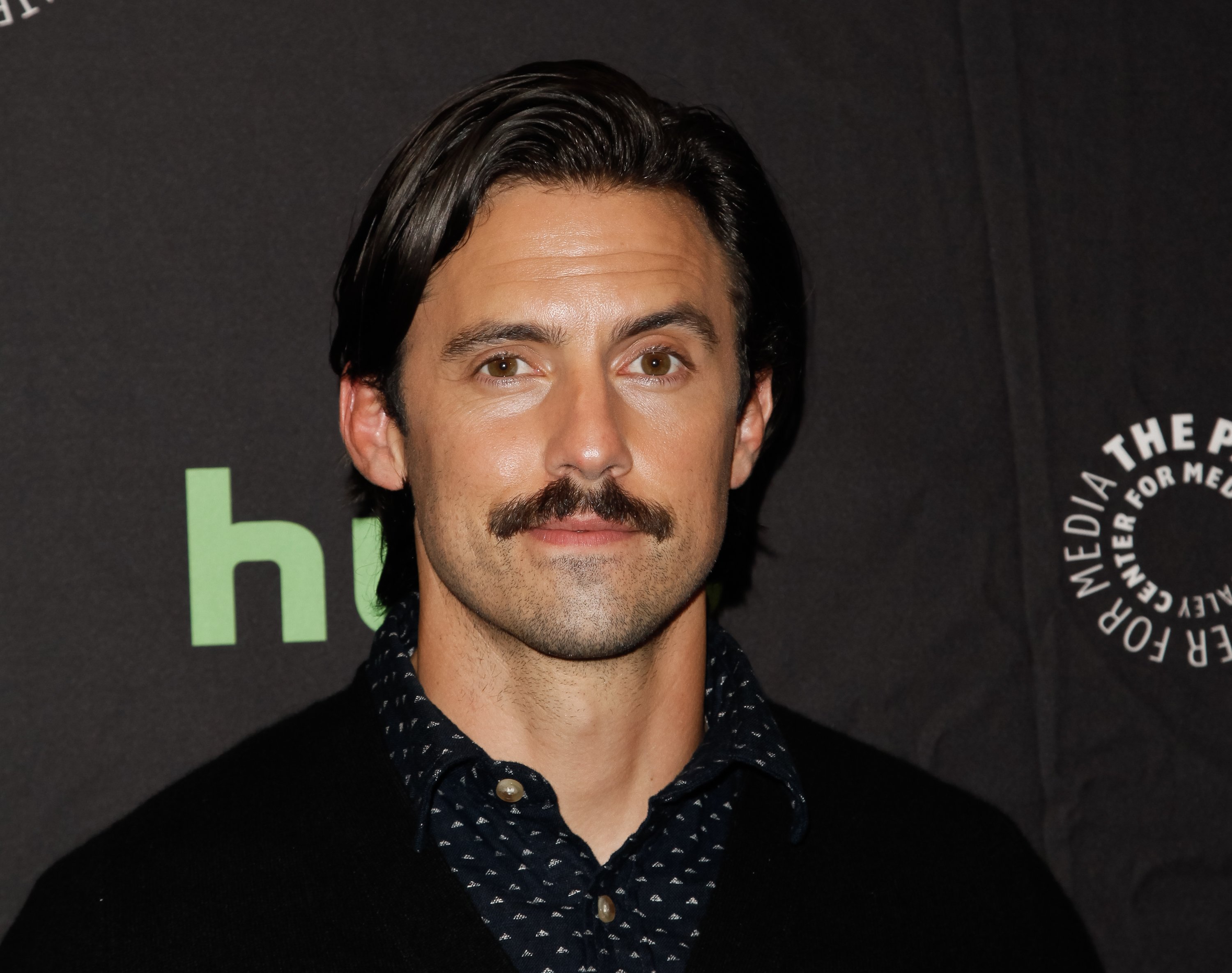 Milo Ventimiglia headshot in front of a dark background