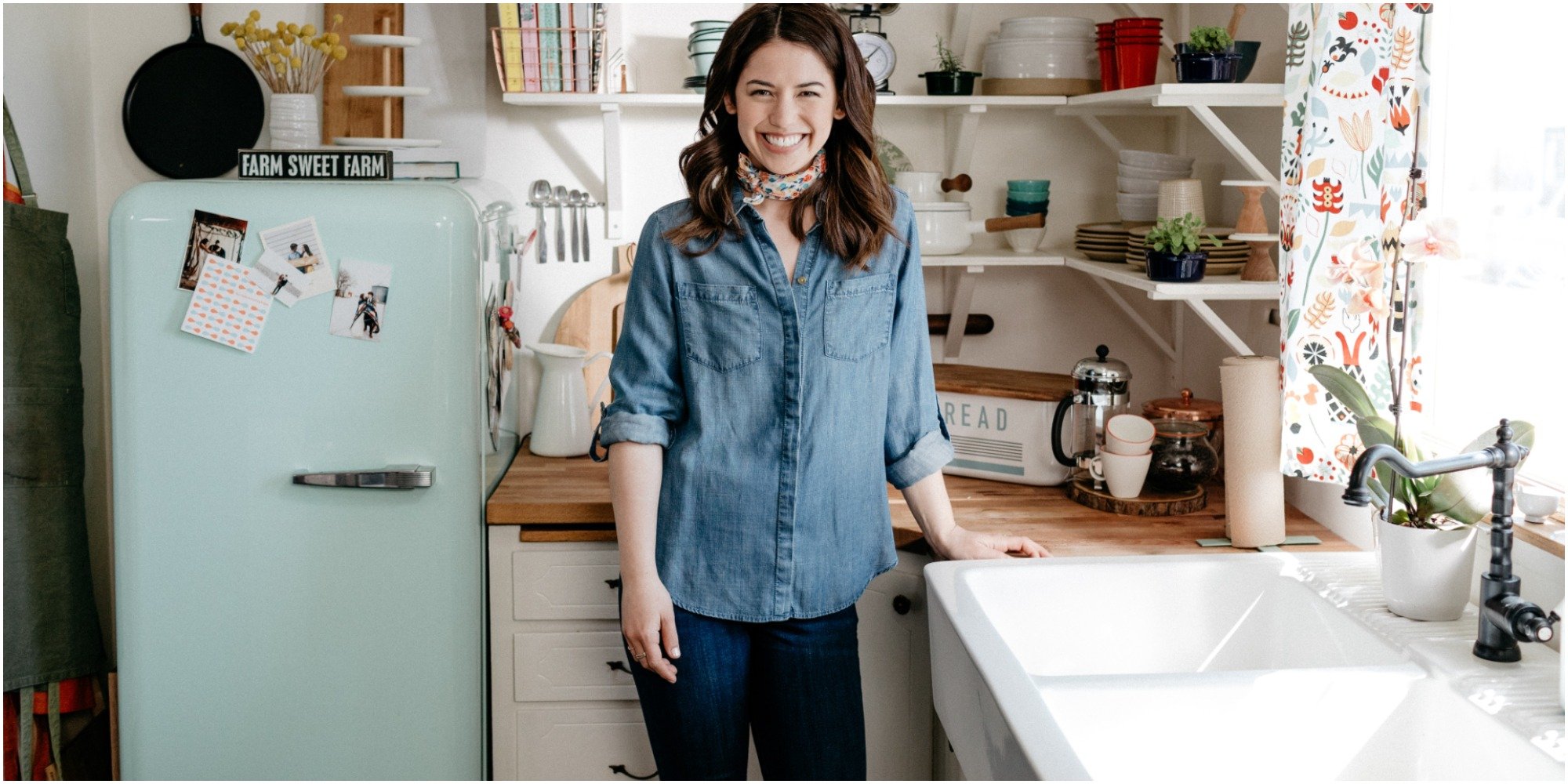Molly Yeh in a denim shirt in her home kitchen.
