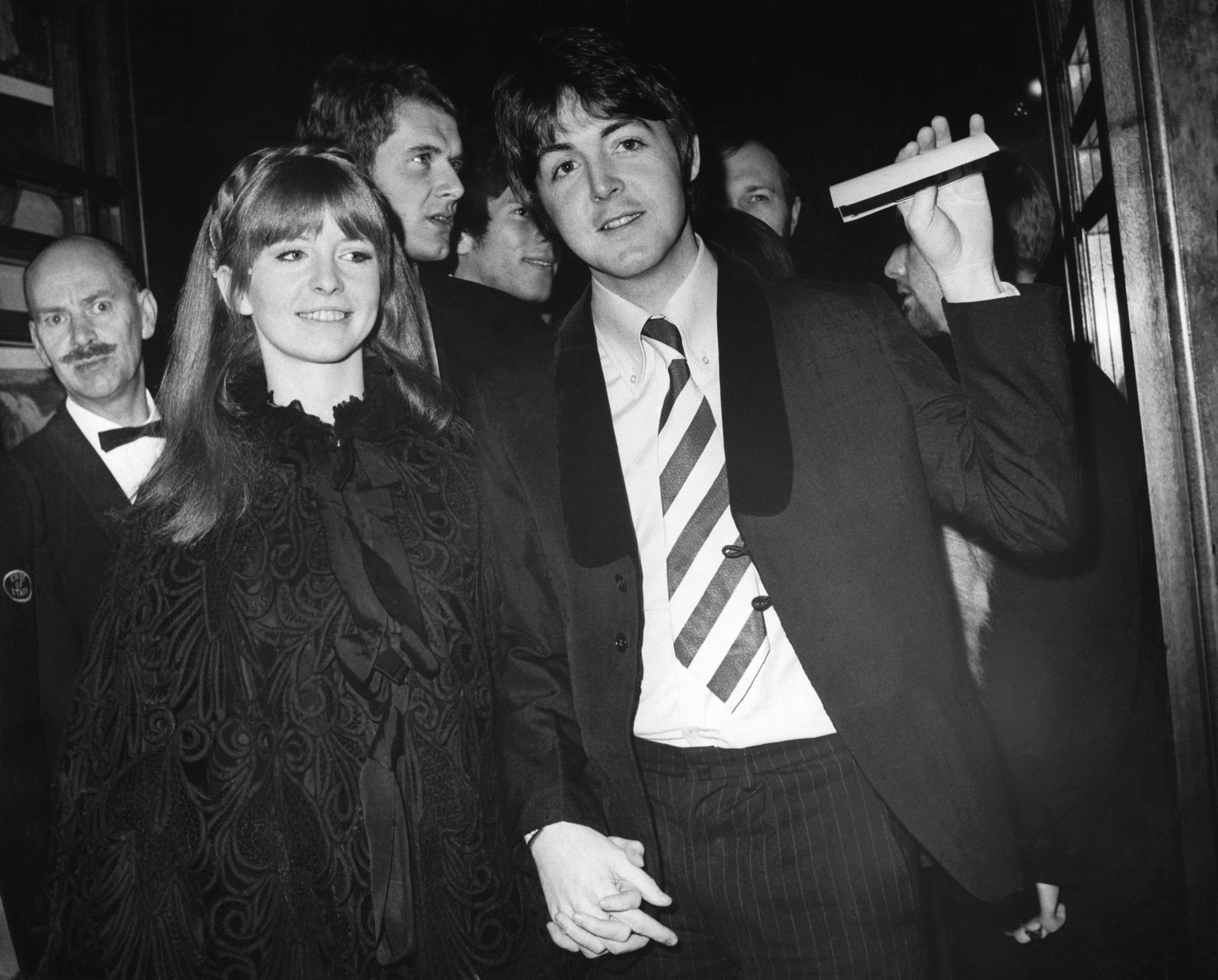 Jane Asher and Paul McCartney in front of a group of people