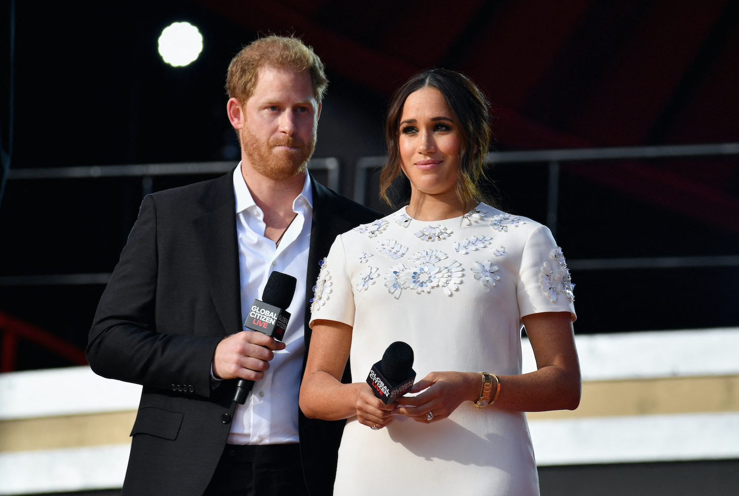 Prince Harry wears a suit and Meghan Markle wears a white dress during the 2021 Global Citizen Live festival in New York City