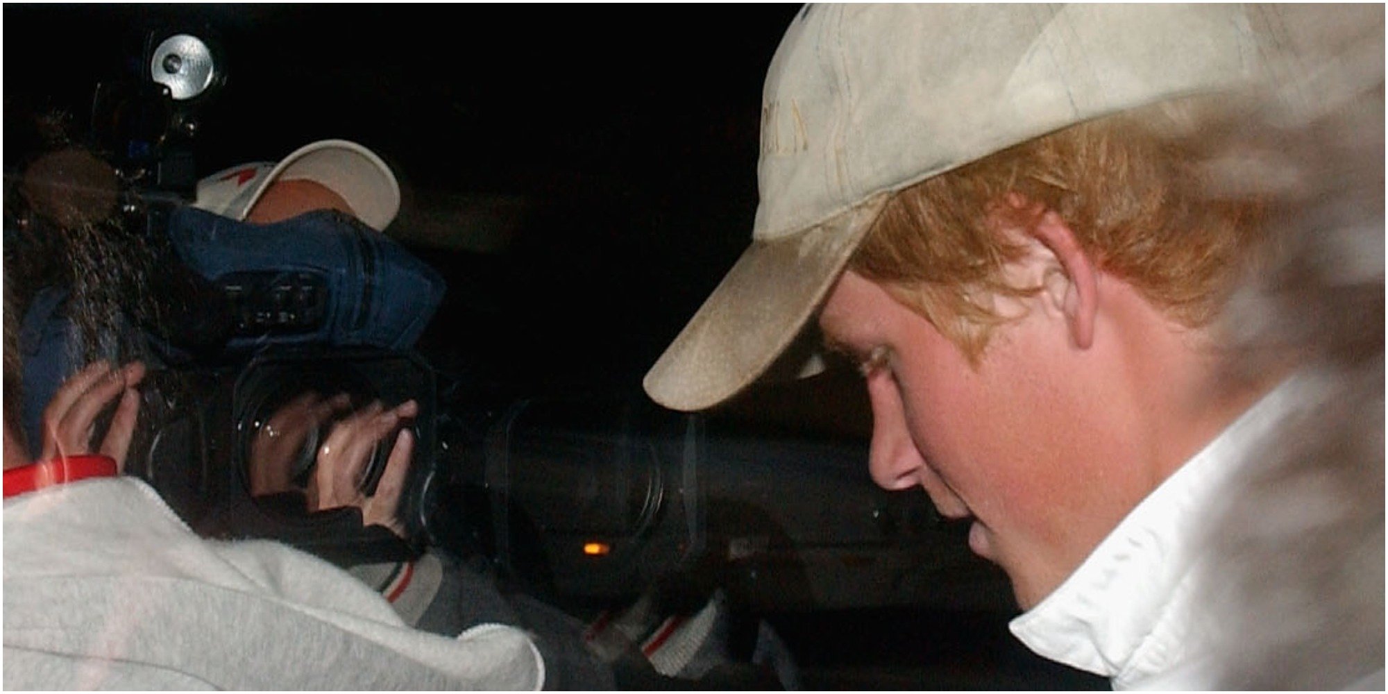 Prince Harry is photographed by the paparazzi in 2003.