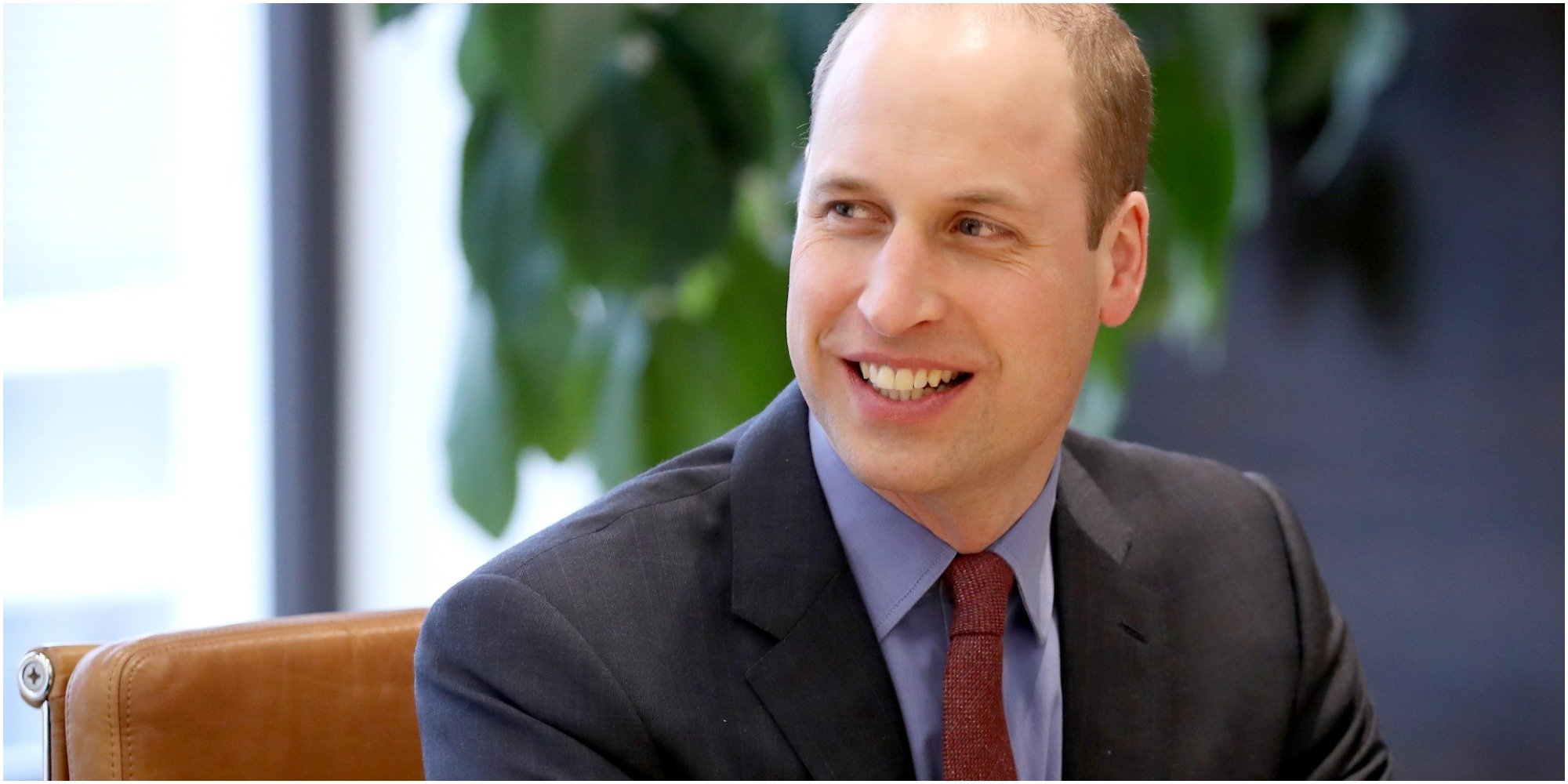 Prince William smiles for the cameras.