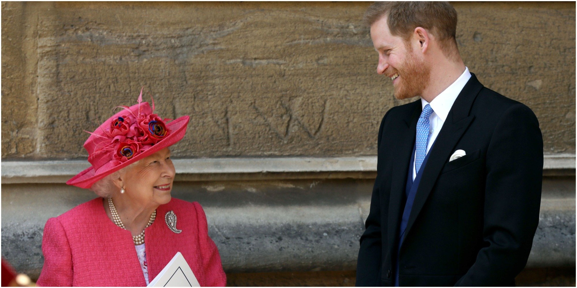 Queen Elizabeth and Prince Harry smile at one another in May 18, 2019.