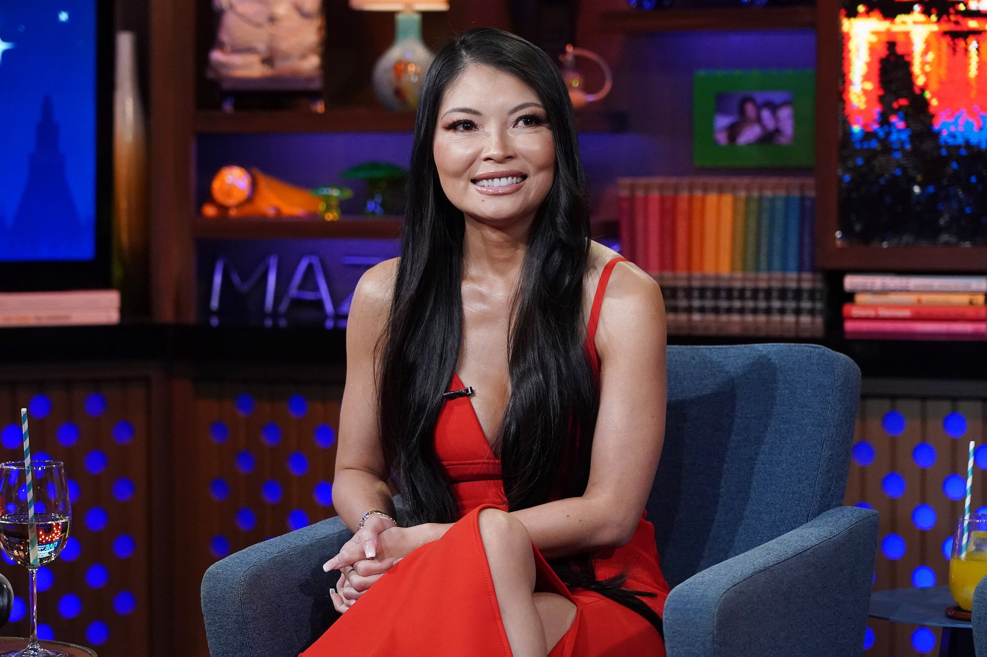 Jennie Nguyen, one of the stars of The Real Housewives of Salt Lake City, in a red dress during a taping of 'Watch What Happens Live'