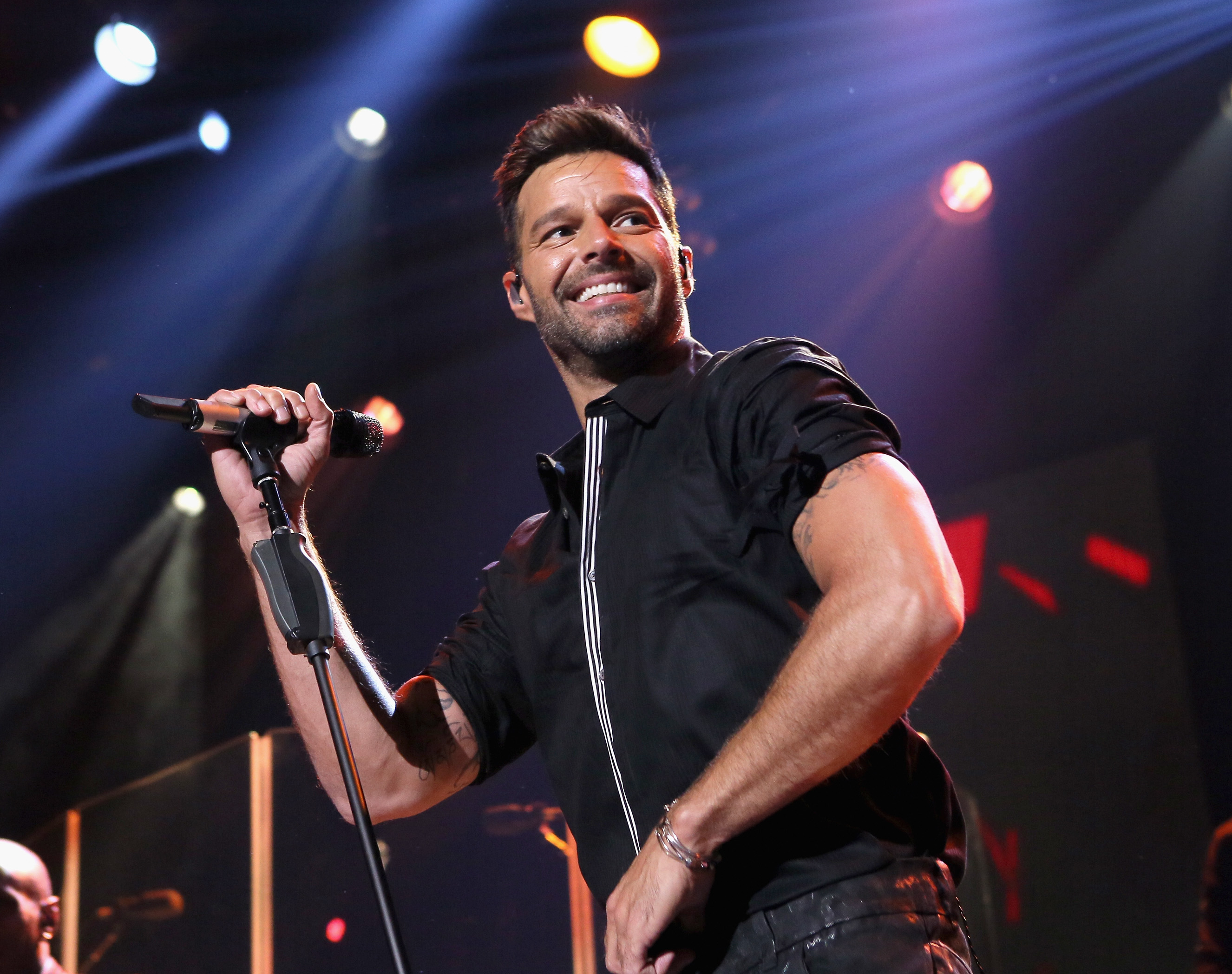 Ricky Martin holding a microphone