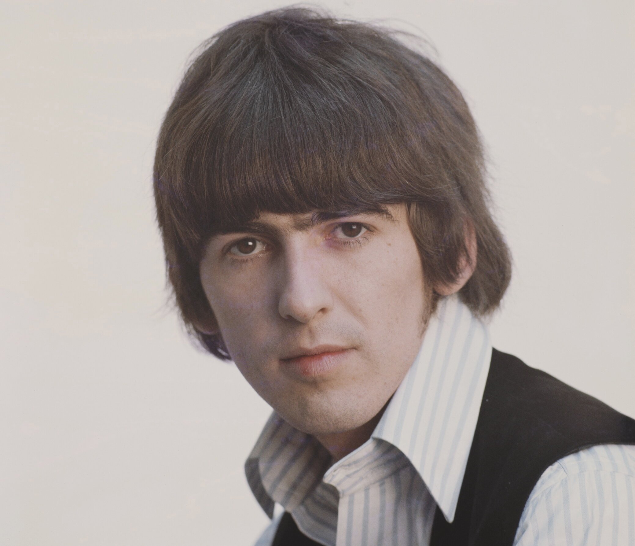Posed studio session of George Harrison (1943-2001) from The Beatles in 1965.