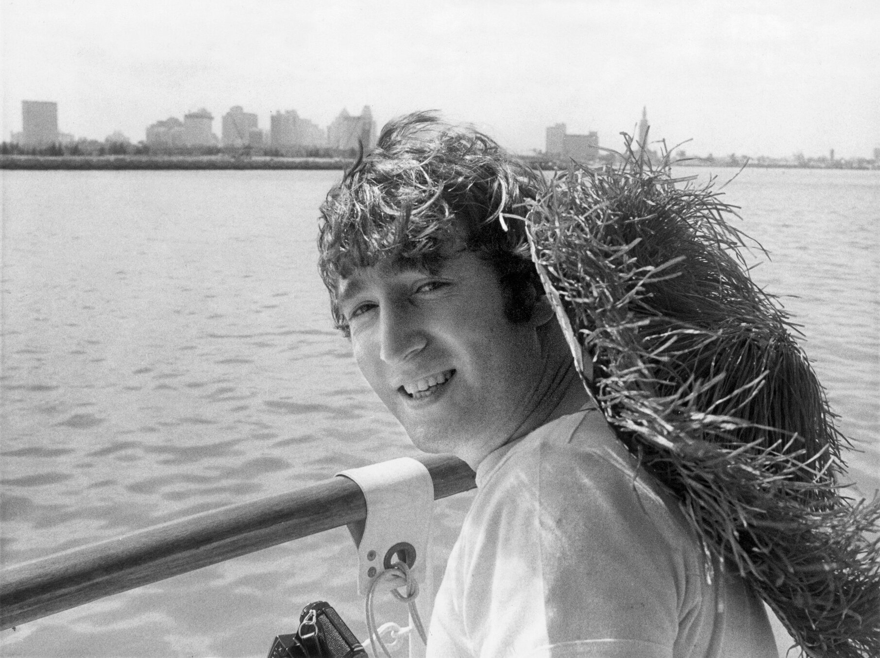 John Lennon wearing a grass and straw hat in Miami, Florida in 1964.