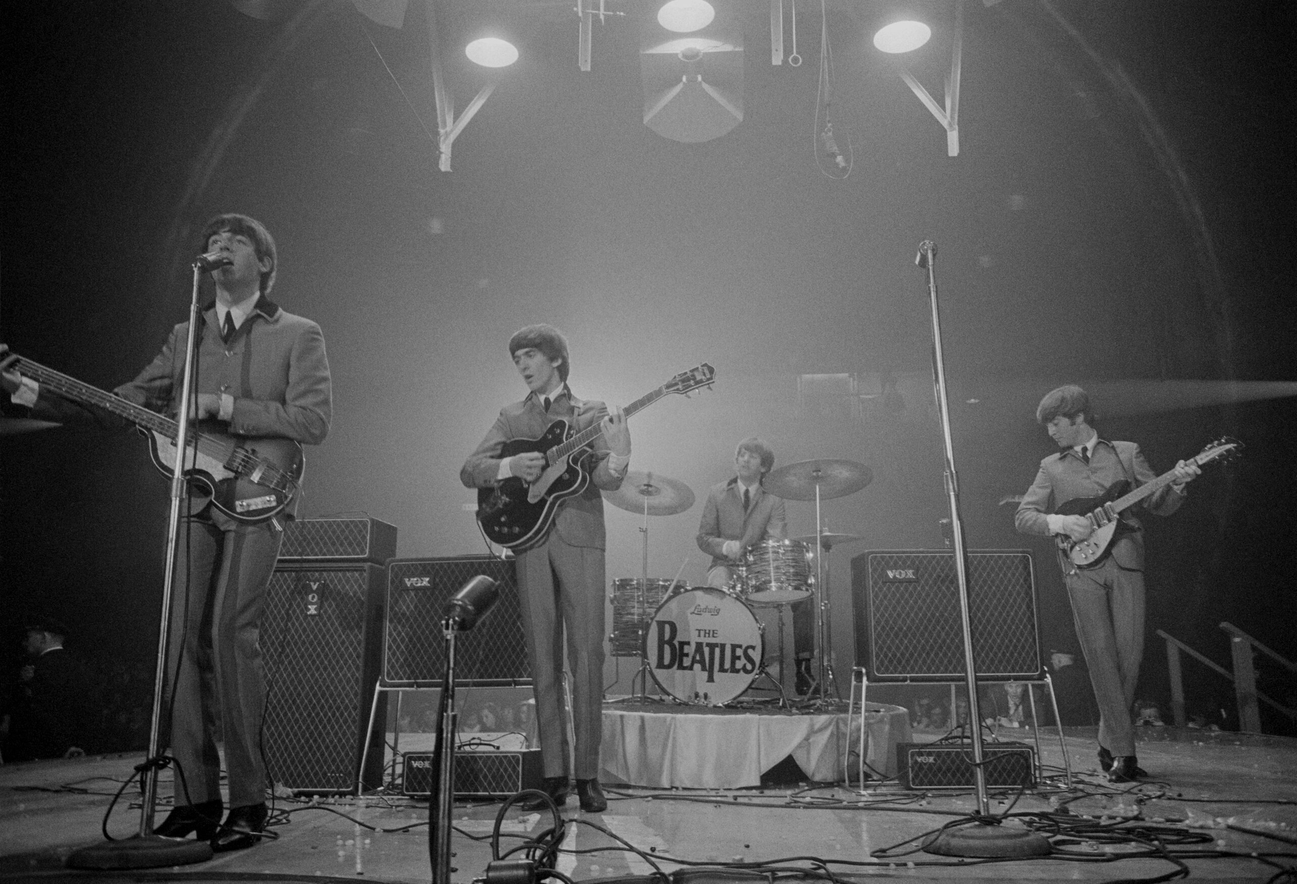 The Beatles perform on stage at the Washington Coliseum, Washington DC, February 11, 1964. The performance was their first US concert, coming two days after their first appearance on 'The Ed Sullivan Show.' Pictured are, from left, Paul McCartney, George Harrison, Ringo Starr, and John Lennon.