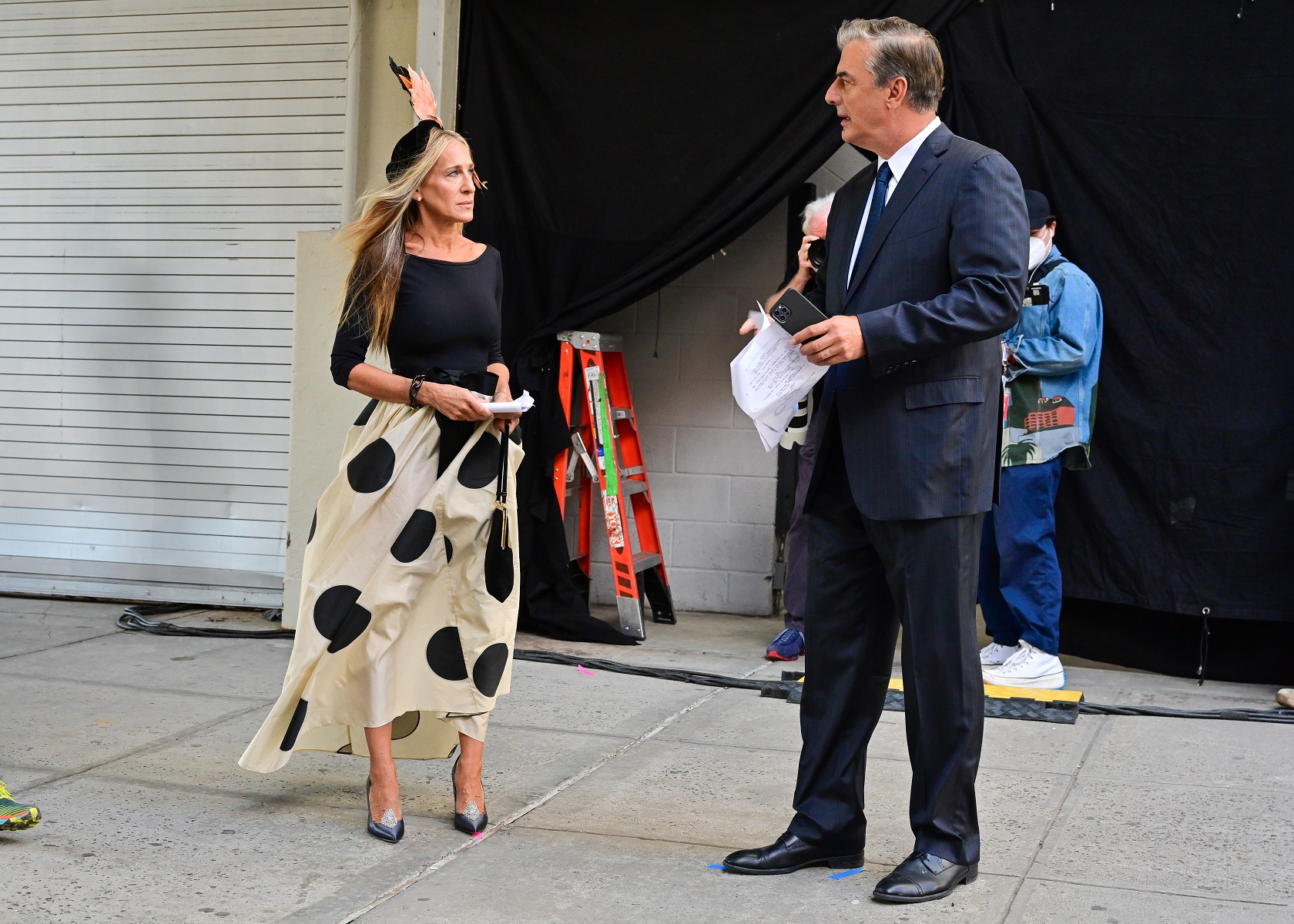 Sarah Jessica Parker and Chris Noth seen on the set of "And Just Like That..." Their characters, Carrie and Mr. Big, are believed to be at the center of the show's drama